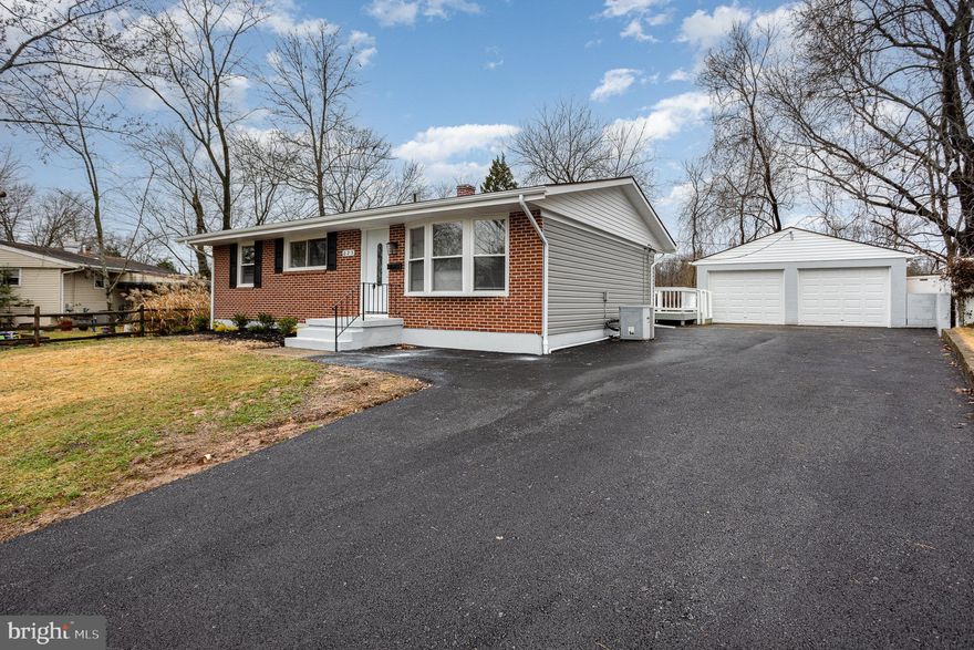 Fantastically spacious move-in ready rancher with detached garage.  WIth 3 upper level bedrooms and 2 additional "bonus" rooms in the lower level, there is ample room to accommodate many.  The kitchen hosts: expansive and beautiful white granite countertops, white shaker style cabinets, stainless steel  appliances and recessed lighting.  The dining room offers table space and is adjacent to the kitchen.  In warmer weather exit through the kitchen sliders, start the grill on the rear deck -overlooking the private fenced rear yard. The oversized 2 car garage is a hobbyist's dream come true.  The welcoming and large living room is a great gathering place, has a convenient coat closet, and cheerful bow window. Meander down the hall where the nicely proportioned bedrooms, full hall bath and primary suite are located. The generously-sized primary bedroom has an ensuite with walk-in shower and double vanity. The finished lower level with walk up exterior stairs  offers a family room space, a full bath, finished laundry center, 2 rooms with several large closets that could host as work from home locations, home schooling, hobby rooms, exercise areas - you name the space. Whether you are inside or outside this property boasts living, storage and entertainment areas far greater than one might expect. The paved driveway leads to the oversized detached garage that is loaded with possibilities.  Convenience abounds with schools, shopping, eateries and commuter routes nearby.