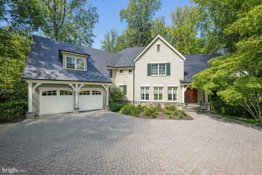 Prepare to be enchanted from the moment you arrive...how do you begin to describe the exceptional construction quality of a home like this?  A  home that won the Maryland Building Industry- Award of Excellence- for custom construction.  The level of attention to detail is nearly impossible to capture in words-it simply has to be experienced to be believed.  And beyond the home itself, this beauty is nestled within the coveted community of Merry-Go-Round Farm - a setting defined by rolling fields, preserved natural landscapes, and a true sense of pastoral serenity.  A sense of community envelopes you with Fourth of July activities, a festive Hallowe'en celebration and so much more, cherished traditions bringing everyone together, creating bonds that make this neighborhood feel more like family than simply a place to live.  Here, horses graze in wide-open pastures, neighbors enjoy miles of trails , and the equestrian center continues the timeless charm of the Potomac hunt country.  From the handsome exterior stone and stucco finish to copper gutters and a slate roof, architectural beauty is on display at every turn.  The rear of the home is as attractive as the front! Inside, the show-stopping eat-in Gourmet Kitchen truly feels like the heart of the home.  A generous center island topped with beveled granite, high-end stainless steel appliances and abundant Decora cabinetry provide both elegance and function.  The field stone gas fireplace next to the eating area adds warmth and ambiance, while the private year round porch invites you to relax in a tranquil, tree-lined sanctuary.   The main level reflects a consistent focus on quality and comfort.  From the marble and wood inlay floors of the foyer, to the soaring two-story Family Room with a stunning floor-to-ceiling stone fireplace, every space is thoughtfully designed.  Front and back staircases, substantial crown and base moldings, a butler's pantry, and a spacious mudroom with a wall of built-ins further elevate your daily living.  Upstairs, the sumptuous Primary Suite is a true retreat.  With a vaulted ceiling, private reading room and a huge walk-in closet, it is both gracious and intimate.  Four generously proportioned bedrooms, each with its own en-suite bath, and a smartly designed laundry room complete the upper level.  Oh! Don't miss the outdoor deck where you can escape to the treetops. The daylight, walk-out Lower Level offers endless flexibility with a sprawling recreation room, an exercise room, a private bedroom/au pair suite with full bath plus additional bonus space to create a media room or wine cellar as you desire.  As throughout the rest of the home, the finishes are of the highest quality, with wonderful ceiling heights and an abundance of space.   The rear yard with a flagstone terrace and tall, towering trees backs to greenspace and, unlike many homes in Merry-Go-Round,  can accommodate an inground pool if that is on your wish list.   This residence is more than just a home - it's a statement of craftsmanship, livability and timeless design.  A property of this caliber, with such an uncompromising level of finish, simply cannot be recreated in today's market at this price.  Don't miss this rare opportunity to own a home that enchants, inspires, and elevates your everyday living - make it yours today!