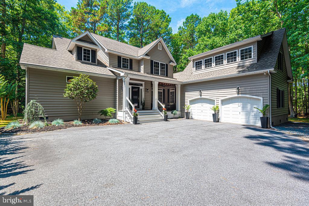 OPEN HOUSE CANCELED SATURDAY 7-13 ! Once in a great while, a unique opportunity arises for you to obtain a property such as this one, where you may be proud to invite your family and friends. Guide your car down the long drive to enter this private estate that sits on 1.5 acres. The entry foyer leads you to a great room with gas fireplace, a formal dining room adorned with crown molding, wainscot wall panels, and double French doors, and a family room with another gas fireplace & exposed ceiling beams. Open to the family room is the welcoming gourmet kitchen, featuring stainless steel upgraded appliances, tile floor and backsplash, extra tall soft close cabinets, wet bar with wine cooler, walk-in pantry and a huge granite center island with 5 burner cooktop and breakfast bar. You’ll be amazed by the primary suite containing crown molding, 2 organized walk- in closets, 2 separate custom wooden vanities, a personal sauna, full tiled 7’x4’ shower, and even heated flooring. French doors open to the rear covered deck for a place of total relaxation, with a 6 person hot tub, stacked stone wood burning fireplace, wooden sofa, swings, vaulted ceiling, ceiling fan, and large screen wall mount TV. On the upper level, two extra large bedrooms, both with organized walk-in closets and dressing areas are connected with a deluxe Jack and Jill bath. A second stairway accesses an impressive bonus room above the double garage. Don’t miss the chance to see all of the numerous features and upgrades for yourself, schedule your showing today!!