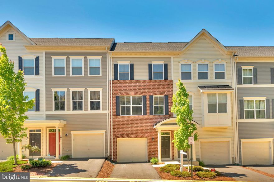 Brick front, 3 level Townhouse with large kitchen, breakfast room, granite counter-tops & hardwood floors.  Spacious master suite and luxurious master bath.  Upgrades include: ceramic tile, walk-in shower and separate vanities.   2 bedrooms boasts its own bath with tile flooring and walk-in closet. Community swimming pool, Basket ball, Club House and playground. Close to Shopping and commuting.