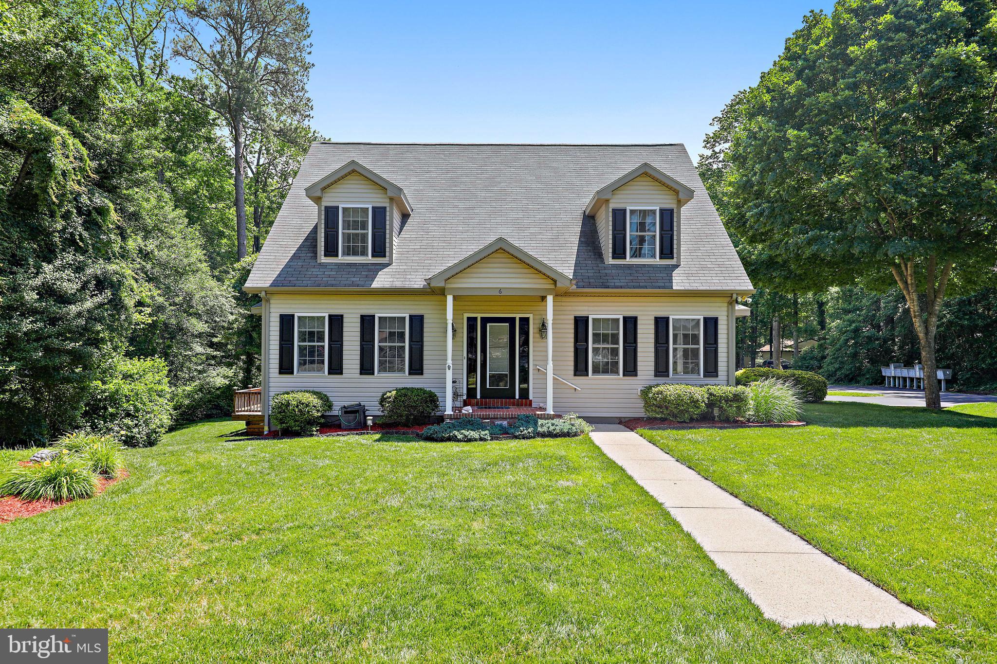 Beautiful 4 bedroom 3.5 bath home in the wonderful community of Ocean Pines! Impeccably maintained inside and out with countless upgrades throughout. Entertain in the spacious kitchen with solid wood cabinets, large island, stainless steel appliances and pantry. The main level offers the option to dine in the dining room or on either of the two decks off of the kitchen, which is perfect for summer cookouts or enjoying some steamed crabs. The first floor boasts a secondary main bedroom and ensuite as well as an open and bright living room. Upstairs you will find three more bedrooms, one of which is another main bedroom and ensuite with two walk-in closets as well as a secondary bathroom. This immaculate home has beautifully maintained hardwood floors throughout as well as granite countertops in all bathrooms with imported tile, custom Pella doors and window treatments, new AC units, tankless water heater, and an upgraded paint package. This stunning home is located in a prime location just 10 minutes from the beach. The Ocean Pines community offers a multitude of amenities and activities for its residents including 5 different pools, various parks, and a beautiful yacht club.