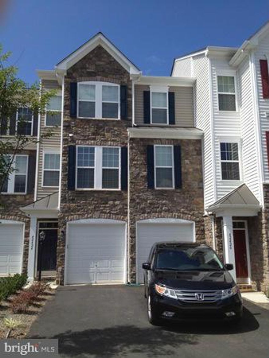 Beautiful!  Still shines like new.  Luxury 2779 SqFt. town home. Features 3 BR & 2.5 BA, main level study, 2 car front loading garage, gourmet kitchen, stainless, and granite. Master bedroom with oversized bathroom. Two rear decks. Rent includes cable and internet. Across the street from shops and restaurants at Brambleton Town Center.