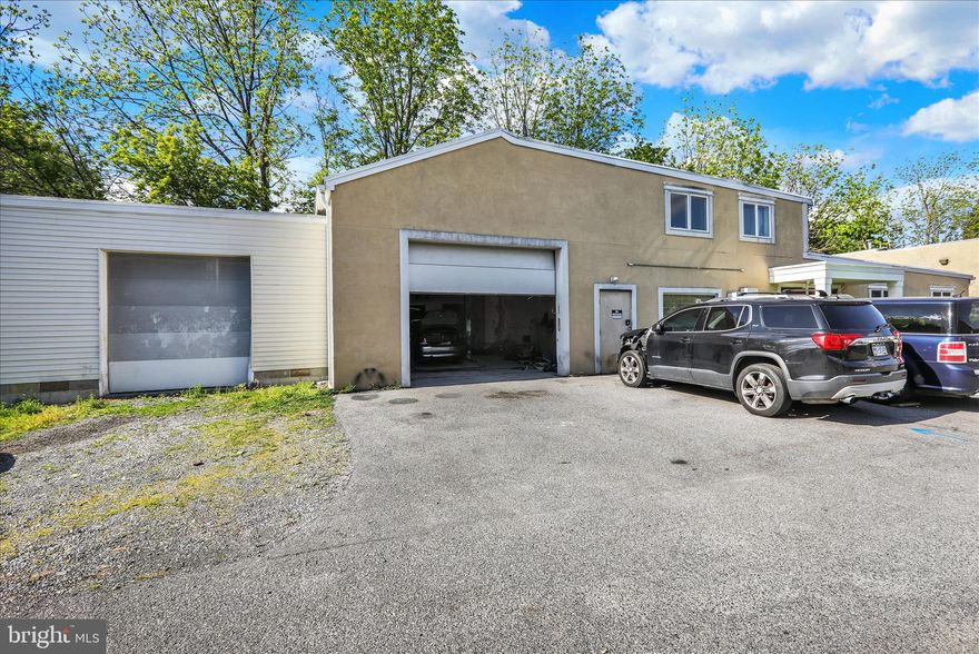 Unique mixed-use opportunity in West Lawn, Spring Township, within the Wilson School District. Located at 2125 Portland Ave, this property offers a flexible combination of residential, office, storage, and garage/shop space. The property includes a 2-bedroom residential unit, making it ideal for an owner-occupant, investor, or business user looking for added income potential.

The modern office space features private offices, a reception area, common work area, kitchenette/breakroom space, multiple restrooms, and additional storage areas. The layout provides excellent functionality for a variety of professional or service-based uses.

For users needing garage, contractor, automotive, or storage space, the property offers two attached garages, including a lift, plus a large detached third garage with its own office space. The garage areas provide overhead doors, work areas, and substantial room for equipment, vehicles, materials, or business operations. Additional covered outdoor storage spaces further enhance the property’s functionality for equipment, inventory, materials, or vehicles.

This is a rare opportunity to combine residential living, professional office space, garage/shop space, and covered storage in one property.

This property will not last long. Schedule a showing today!