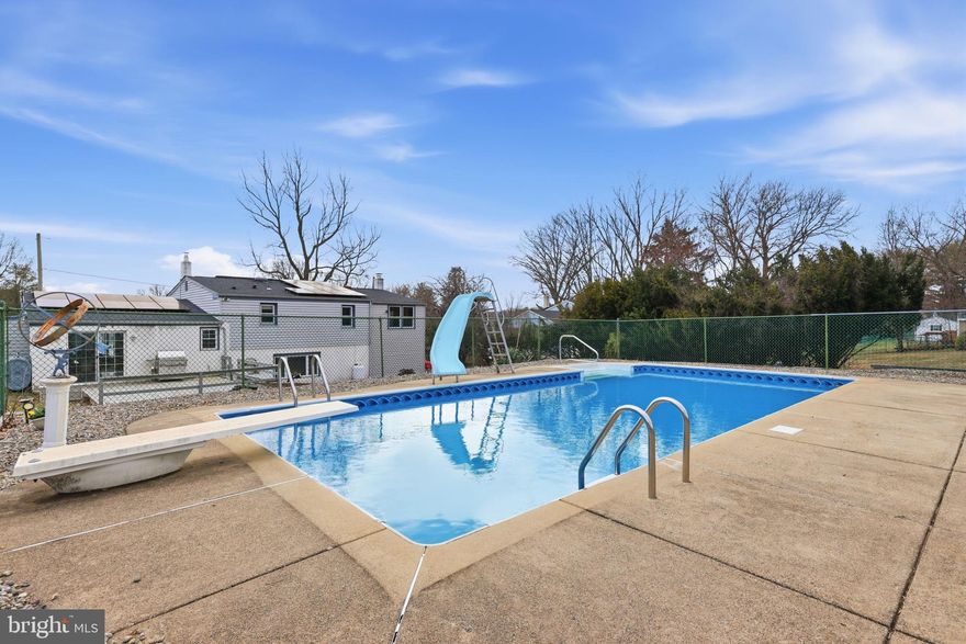 POOL IS OPEN - practice your diving or have a blast going down the slide! Get ready to send your Save the Date invitations to your first pool party!  95 Longview Drive is a rare 5-bedroom home featuring a spacious backyard with an in-ground pool and beautiful landscaped retaining wall, ready to display the colors of your favorite flowers, and screened-in porch with hot tub in the highly sought-after Council Rock School District.

The living room has a large bow window and refinished hardwood floors. The heart of the home is the expansive, updated kitchen featuring Thomasville cabinetry, granite countertops, stainless steel appliances, reverse osmosis water treatment system under the sink, gas (propane) cooking, and durable water-resistant flooring. With plenty of space for a full dining table and sliding glass doors that lead directly to the deck, this kitchen is designed for both everyday living and effortless entertaining.

From the kitchen, step outside through the sliding glass doors onto your deck, overlooking your large backyard,  Connect your BBQ grill right to the propane - no need to  worry about running out of gas half way through cooking for a crew. Just off the living room is the spacious screened-in porch with included hot tub to create a relaxing, all-season escape.

Back inside, down a few stairs, the recreation room takes entertaining to the next level with a bar and current club-style setup, featuring a disco ball, sound system, and laser lighting — an unforgettable space for hosting and fun. Imagine what you can do in this room! If that is not your vibe, imagine a playroom, exercise area, co-working spot, game room, whatever fits your lifestyle. The oversized family room has a wood-burning fireplace and front-facing bow window, giving you the perfect place to unwind. 

On the upper level, you’ll find all five bedrooms are generously sized with lots of closet space — a rare find at this price point in Northampton Township. The primary bedroom has a full bathroom and there is a fully renovated full bathroom with tub/shower combo in the hallway. Additional highlights include OWNED solar panels, providing SIGNIFICANT ENERGY SAVINGS PLUS PASSIVE MONTHLY INCOME (2025 THE SELLER RECEIVED APPROXIMATELY $2,700) based on energy production, roof was replaced in 2018, pool pump is approximately 3 years old, the driveway was resurfaced 3 years ago and the Seller is including a premium American Home Shield home warranty for the next owner’s added peace of mind.

Located in Churchville, near the shops, dining, and attractions of Richboro, Holland, and Newtown — and all that Bucks County has to offer — this is a truly special property you won’t want to miss.

NOTE: All square footage and dimensions are approximate. No representation is made to the accuracy thereof.