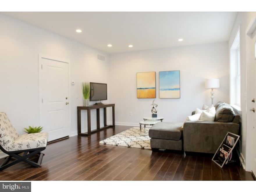 Six brand new homes with features Port Richmond, Fishtown, and the surrounding areas have never seen before. These are 25 ft. wide homes. Pull into a gated driveway and into your garage. From the garage you will walk into a huge living room with space for an optional dining area. The main floor also has a half bathroom and large kitchen. The kitchen has tons of granite covered counter space, a granite covered island and space for a breakfast/coffee area. The finish on the main floor includes dark 5" wide wood floors throughout, brushed nickel hardware, and stainless steel appliances. The center piece of the second floor is a huge master suite featuring two double door closets and a walk-in closet. The master bathroom is also humongous with a double vanity, large shower, and a fantastic tile scheme. The two additional bedrooms also each have double door closets. The shared bathroom has another double vanity with classic white subway tile in the shower and gorgeous grey floor tiles. A laundry space finishes off the upstairs space so the wash doesn't go up and down stairs in these homes. The lower level is where the owner can get creative. It has incredibly high ceilings and tons of natural light. The space can be used as a family room, game area, media space, art studio, den, office, entertaining space and there is plenty of room to do a combination of these options. These homes also offer an additional driveway space, a garden area and the ten year tax abatement. They are located across from a park with deli's in two blocks in both directions. Restaurants, bars and more parks are only a short walk away. When you're driving, Allegheny Ave right around the corner offers easy access to wawa, center city, and even NJ. Come check out these homes: they're gorgeous! Floor plan is over 2,500 sq.ft. total. Verizon Fios is now in the neighborhood as well as Comcast. Pets are encouraged. If you don't have one the owner will give you some. $200 deposit per pet. No limit.