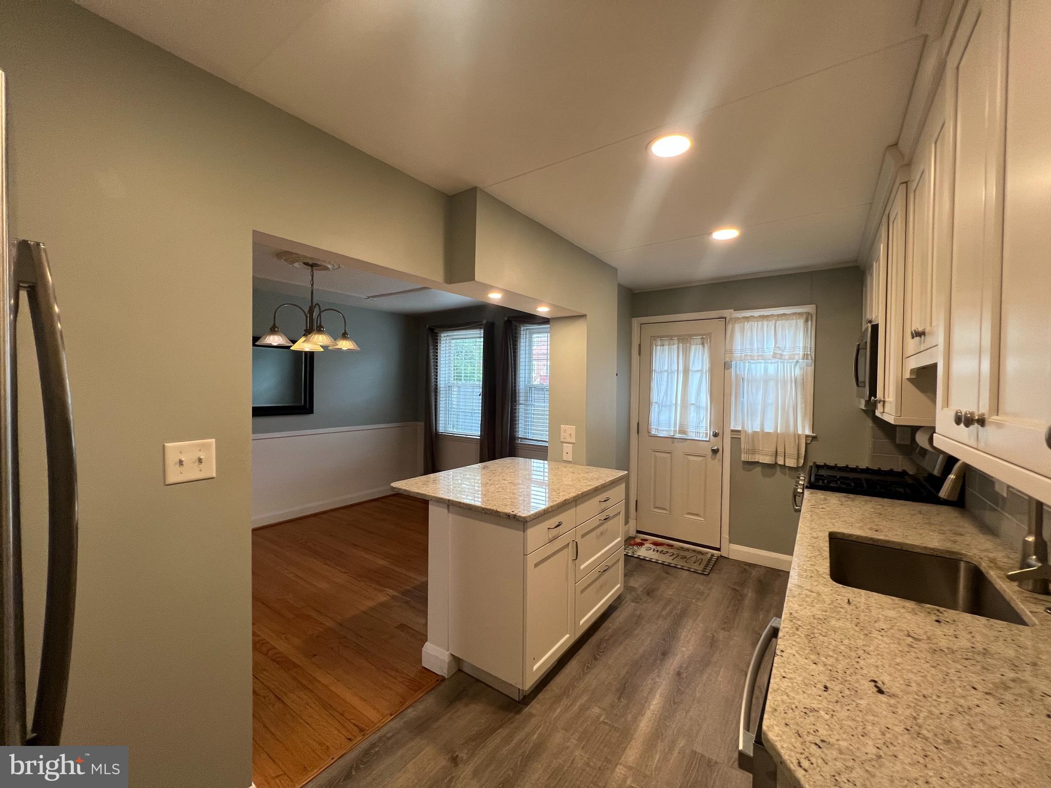 This beautifully updated 3-bedroom, 1.5-bath home is available for lease and ready for immediate occupancy. Enjoy the charm of the covered front porch before stepping into a bright and inviting living room featuring wood floors, recessed lighting, and a bay window. The modern kitchen and dining area are fully equipped with stainless steel appliances, granite countertops, recessed and under-cabinet lighting, and a peninsula with seating — perfect for everyday meals or entertaining. Upstairs, you'll find three comfortable bedrooms and a stylishly renovated full bath. The lower level offers a spacious family room and convenient half bath, ideal for relaxation or a home office setup. Additional updates include a new kitchen (2019), roof (2020), and HVAC system (2022), ensuring comfort and peace of mind. Off-street parking adds to the convenience.
Don’t miss the opportunity to lease this move-in-ready home!