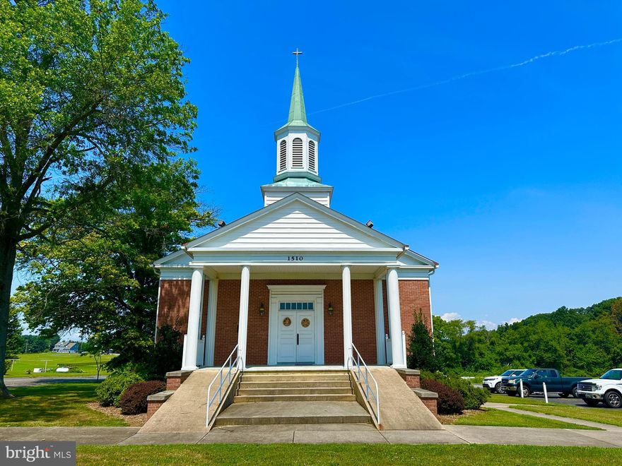 The former Mt. Vernon United Methodist Church is a stately brick house of worship, built in 1960 on ±7 quiet acres, just 15 minutes from Bel Air.  This well-maintained church building includes 2.5 levels.  The main level offers a bright, airy sanctuary with pew seating for approximately 150-180, and chair seating for another 24 in the choir wings.  There is also an entrance foyer, a nursery with viewing window, an ADA-compliant restroom.  Behind the sanctuary are two small offices and stairs leading to the lower level.  The lower level includes a hall, kitchen, four classroom spaces, restrooms, storage, and mechanical room. The topmost level is office/lounge space and storage (with an unfinished attic above).  The building is served by central air and heat, well water, and a septic system.  The property includes a cemetery, part of which is located on a separate parcel (see photo of parcel outline).  The new owner is responsible only for lawncare; headstone maintenance is handled by families.  The new owner will also be required to provide cemetery access to visitors during reasonable hours.  To schedule a tour of the property, please have your real estate professional book through ShowingTime.  There is no option to lease.  Most chattels convey with the sale. The seller has limited knowledge about the property and welcomes buyers to undertake a full inspection.  The property is sold as is. Owner financing may be available for a full-price offer from a buyer who intends to use the property for worship. Typical financing terms: 30% down, 7% interest, amortized over 20 years, 5-year balloon.  The seller makes no representation regarding condition, zoning, or use.  Buyers should address any issues during the study period.