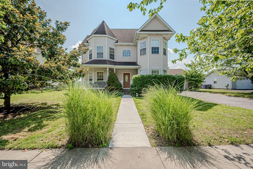 Rarely available, 5 Bedroom, 2.1 Bath home with a garage in Frisby's Meadows, a beautiful tree-lined neighborhood with sidewalks.   This home has great curb appeal and a welcoming wraparound porch.  As you step into the beautiful entryway, notice the gleaming hardwood floors.  Pass through the archway into the large living room with gas fireplace.   There is a spacious dining room and a separate breakfast area.  The kitchen offers plenty of storage with 42” cabinets & a large pantry.  A powder room & laundry area complete the main floor.  Upstairs, the large main bedroom includes a sitting area and En-Suite 5-piece bathroom with double vanity and soaking tub separate from the shower.  The generously sized 2nd and 3rd bedrooms are on this floor, along with a hallway full bathroom.  On the 3rd floor, there are 2 more large bedrooms.  Back on the main floor, sliding glass doors open onto the new large composite deck, perfect for entertaining family & friends.  The large fenced-in backyard also has an above ground saltwater pool, and the property backs up to a pond, offering peaceful views of lush greenery.  Located in Cecilton, MD, approximately 20 miles south of Elkton and about 10 miles west of Middletown, Delaware.  Schedule a showing today and Welcome Home!