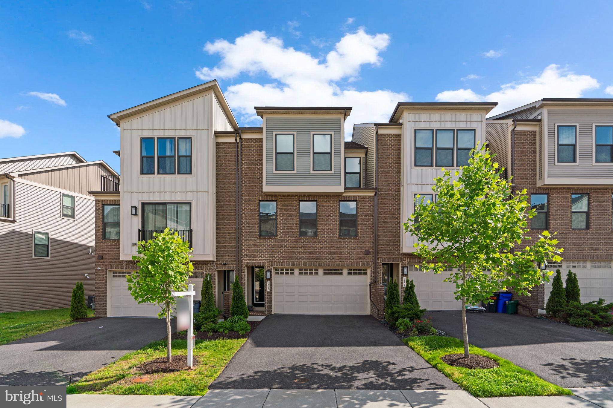 Stunning Colonial built in 2022 by NV Homes in sought-after Cedar Creek. Designed with modern living in mind, this home showcases stylish finishes, an open layout, and abundant natural light throughout. Step inside the entry-level featuring a welcoming foyer with a powder room and a hallway leading to a flexible space currently used as a gym, complete with exterior access. Ascend to the bright and spacious open-concept main level where luxury vinyl tile flooring extends across the sunlit living room with a convenient powder room, the adjacent dining area, and the kitchen. The eat-in gourmet kitchen impresses with upgraded quartz countertops, a queen-sized island with breakfast bar seating and pendant lighting, stainless steel appliances, a classic white subway tile backsplash, and sliding glass doors that lead to a large private balcony—perfect for relaxing or entertaining.
Upstairs, luxury vinyl tile continues into all three bedrooms, including the primary suite featuring a tray ceiling, a large walk-in closet, and a spa-like ensuite bath with an extended quartz double vanity and a sleek frameless glass-enclosed shower. The second bedroom also includes a walk-in closet. A full hallway bathroom and centrally-located laundry complete the upper level. Out back, enjoy a peaceful open common area with a playground—ideal for outdoor fun and community connection.