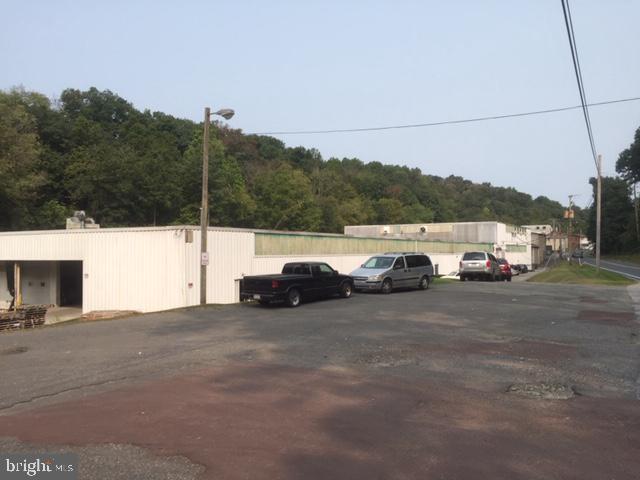 Industrial Investment Opportunity. Approximately 50,000 SF +/- comprised of:
1) 38,000 SF (14' ceiling clear), 1st floor tenant = hardwood distributor; and
2) 12,000 SF (10' ceiling clear), 2nd floor tenant = flag manufacturer/distributor and includes freight elevator.
Both tenants have 5-year leases (commenced on July 1, 2021) + one, 5-year option. The two Premises have separate, electrical service, gas service, loading/delivery facilities and restrooms.
Brokers and prospective buyers must sign a confidentiality and non-disclosure agreement prior to the release of leases and financial information.