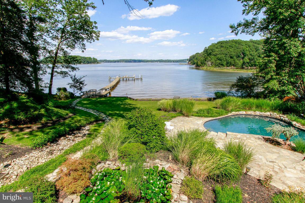 Magnificent waterfront home on the Severn River offering breathtaking waterfront vistas. Premium lot of 2.36 acres and over 300 feet of waterfront with ample space for entertaining. Water side swimming pool w/ waterfalls, flagstone and decks. Boathouse, Deep Water Pier, 2 Boatlifts and Generator. 1st Floor Master Suite. 2 double sided Fireplaces. Convenient to BWI, Baltimore & Washington, DC.