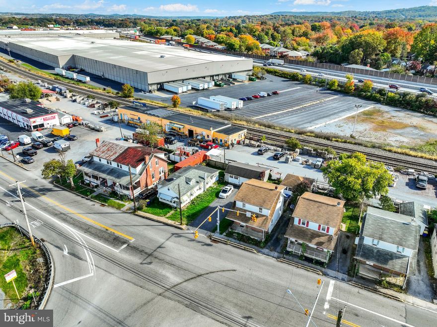 Mixed-Use Industrial • Commercial • Residential | ±3 Acres | Income + Redevelopment Potential

An exceptionally rare mixed-use opportunity in Camp Hill, 302 S 18th Street spans nearly 3 acres and combines industrial, commercial, and residential components—offering both strong existing income and significant redevelopment potential.

The commercial portion of the property is currently used as a construction and masonry supply center, with ample space for material storage, heavy equipment, and contractor operations. Portions of the lot have also been leased in the past for U-Haul truck and trailer rentals, showcasing the site’s versatility and additional income potential.

Property Components Include: