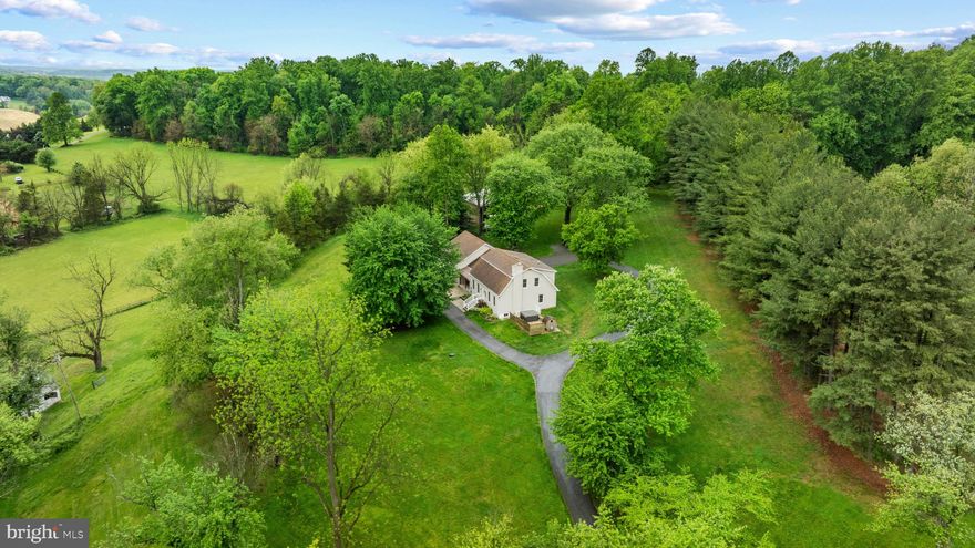 The possibilities are endless! Looking for a farmette/homesteader property in sought after Mt. Airy? This is it! Amazing private Mt. Airy estate within commuting distance to DC/Baltimore. Do you want to bring your horses home? Large 3 bay pole building could easily serve as a run-in shed, add stalls, equipment storage or a combination! Small bank barn could house goats/sheep/cows with plenty of hay storage above. Or it could serve as a great hang out if animals aren’t your thing. Next to the bank barn is a small spring house providing a natural water source. Chicken coop, raised garden beds are perfect for all your homesteading needs. Inside you’ll find a large eat in kitchen with AMAZING views overlooking the property from the bay window. Kitchen features stainless steel Café dishwasher/microwave and an LG stove. The main level includes a primary suite with gas fireplace, full bath, walk in closet, custom wood trim and window darkening shades. Upstairs are 3 additional bedrooms to include a 2nd primary suite and additional bath. The basement was finished in 2023 and offers a rec room, bedroom and full bath with separate entrance. Additional outdoor features include Hardy Plank siding, cedar wrapped front porch with outdoor TV/Speakers, SISU Sauna, hot tub, and fire pit. Fully fenced perimeter with 3 board fencing and mesh wire and remote-controlled gate. Wired internet, EV charger and whole house generator. This house has something for everyone!