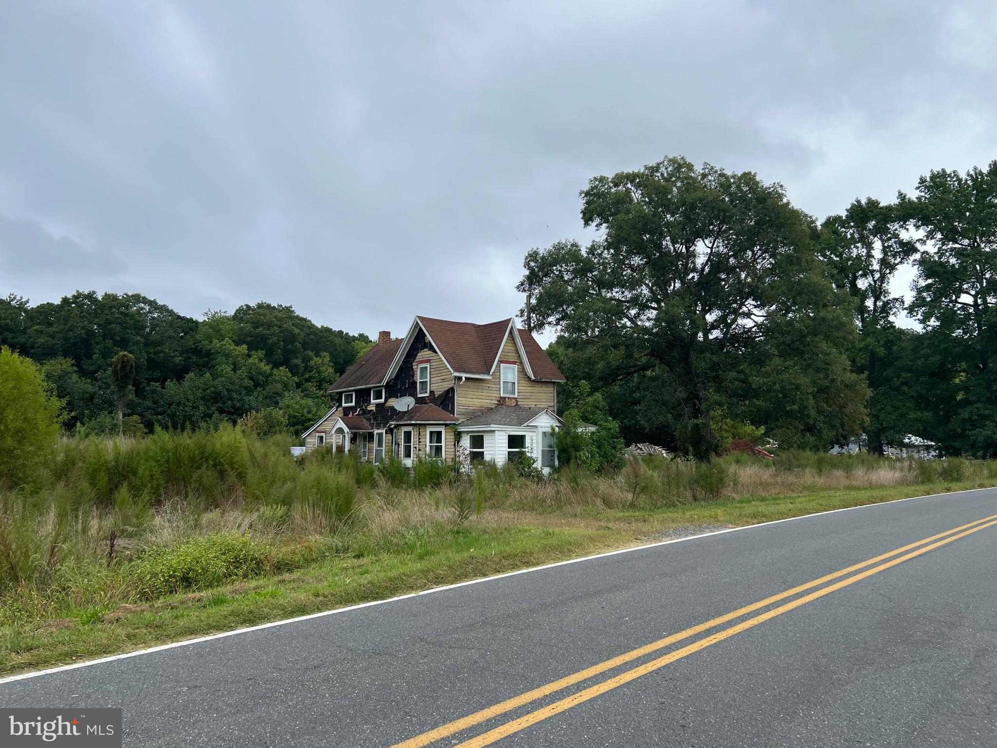 Country living close to the beach. Just over 5 acres of land ready for redevelopment. Well and septic already in place.