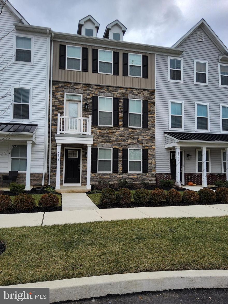 Do not wait to schedule an appointment to see this beautiful Pipersville rental.  This 2 year young, gorgeous townhouse is waiting for you to view.  It is part of the Lennar townhome community of Lantern Ridge.  This unit is the Harper model.  Pull up to this modern style townhome with a beautiful stone front  and tastefully selected siding.  You will notice the nice landscaping in the front.  If you park out front, you will enter into the Main level where there is the 2 car garage access into the home as well as a Bedroom that has it's own full bath with a walk in shower.  This could be used for in-laws, the primary or a guest room.   Access to the 2 car garage is on this floor.  Garage is rear facing and there is also driveway parking behind the home.  Head on up to the 2nd level where you will find the main living space.  This level has the Living Room, a half bath, the Kitchen, and Dining Room.  The Living Room is of nice size and is open to the Kitchen.  The kitchen is to die for!  This kitchen is white and has amazing granite countertops, lots of storage in the cabinetry, an island that is enormous and has plenty of storage underneath.  The appliances are all stainless steel and 2 years old.  There is a gas cooktop,  refrigerator, dishwasher, oven, microwave and a rangehood.   White subway tiles are the backsplash for this amazing kitchen.  Nothing was overlooked when they put this kitchen together.  The flooring is a dark plank style that really compliments the brightness of the rest of the kitchen.  Even though this home has natural lighting, it has recessed lighting as well.  The Dining Room is right next to the Kitchen and has direct access to the deck for outdoor entertaining.  Don't forget the walk in pantry if you need more storage!   Go up one more level to find the Primary Bedroom Suite complete with tray ceiling,  primary bathroom with a walk in shower and dual vanities.  You will also find the 2nd and 3rd bedrooms that share a hall bath and it has a tub.   The laundry room is also on this level.  Snow removal and lawn care is included as well as trash.  Landlord pays the HOA fees.  If you haven't heard enough to schedule an appointment, then how does walking to restaurants and stores sound?  Public transportation nearby for commuters.  Landlord is looking for smoke free tenants.  Pets are on a case by case basis and landlord reserves the right to decline based on size, breed or number of pets.