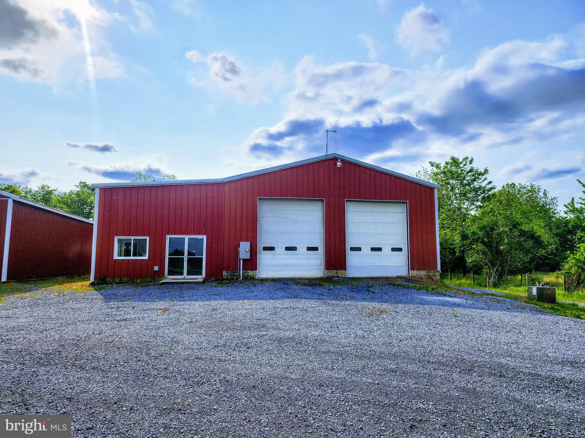 Introducing an exceptional commercial lease opportunity for entrepreneurs and businesses seeking a versatile and dynamic space to expand their operations. Nestled on a sprawling 3-acre storage lot, this well-maintained property boasts multiple pole buildings and flex office/warehouse space, offering unparalleled flexibility and convenience.
Key Features:
Multiple Pole Buildings: The property showcases a collection of well-maintained pole buildings, providing ample space for various uses. Highlights by a central building with 3 14ft overhead doors and a 600sf office space. The garage/warehouse portion is over 3000sf, featuring 2 overhead doors in the front and 1 in the rear, allowing for drive-through capability. There is also a 3072sf 6 bay open-sided building, allowing for storage of large equipment. There is also a 3 bay open-sided building and small covered pavilion area.
Expansive 3-Acre Storage Lot: Enjoy the advantage of a vast fenced storage lot, providing abundant outdoor space for parking and material storage. This generous lot ensures convenient accessibility and efficient utilization of resources, allowing you to optimize your business operations.
Prime Location: While tucked away out of sight off of the main road, this property benefits from excellent connectivity to major transportation routes, ensuring smooth logistics and convenient access for both clients and employees.
Well-Maintained and Modern: The office was renovated in 2015 and had central air for cooling. 400 amp electrical service was updated in 2018.
Usage: Not suitable for high traffic retail. Possible uses include landscaping company, construction company, mechanic shop, etc.