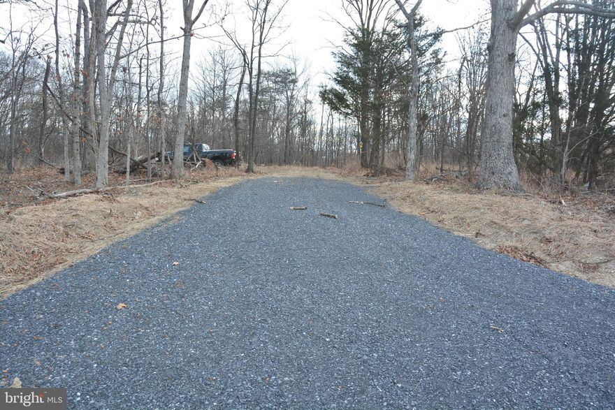 This is Lot #2, one of four lots currently available in Cross junction, off N Timber Ridge Road in northern Frederick County, VA.  If you have been looking for a private, wooded, rural area to build, you really need to get out and walk the properties to appreciate the characteristics.  Really pretty woods with pleasing building sites.  No HOA here.  All lots have 4 bedroom septic approval. Access to electric is right there. All lots are minimum 5 acres.  Under a half hour to either Winchester or Berkeley Springs, WV.  Ask for plats and the tax map before venturing out.