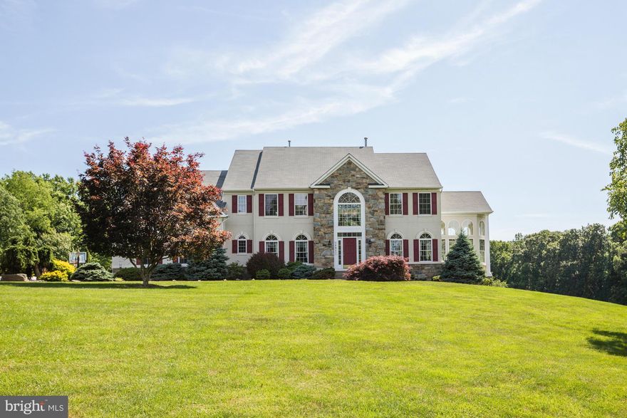 One of the largest models in Spring Meadows on over 20 mostly wooded acres at the end of a cul-de-sac, perfect for horses and nature lovers. Updated kitchen with stainless steel appliances, granite counters and beautifully tiled floors all baths updated. Terrific entertaining spaces both inside and out on the deck with gazebo, two story family room w/floor to ceiling stone fp, finished lower lev.