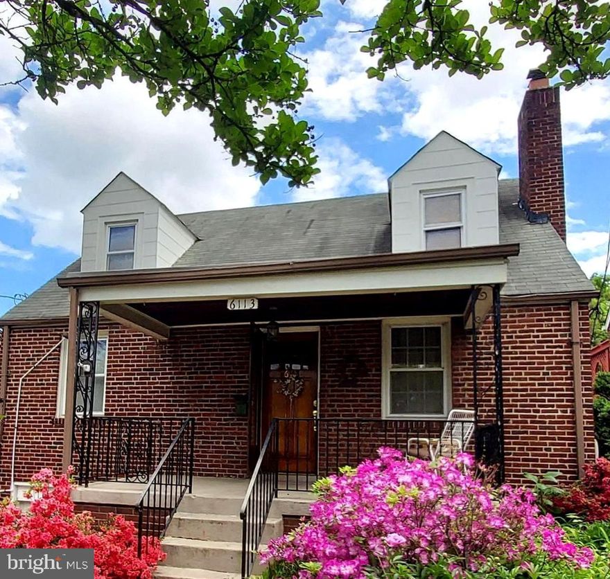 Ideally Situated on the Sweetest Street (where Riverdale and Hyattsville meet!), this Tastefully and Stylishly Updated Cape Cod is Certain to Charm and Enchant.  Mid-century Meets Modern with Plenty of Pretty, Preserved Period (1938) Details.  The Fully Renovated Kitchen is Sun-Soaked and has an Open Soul that Joyfully Joins the Dining Room to Encourage Bright Brunching, Light-filled Lunching and Engaged Entertaining.   A Gorgeous Gift to Your Family's Culinary Creative, the Kitchen also offers GE Profile Appliances (Gas cooking), 42" White/Glass-front Cabinets (with undermount lights), and Silestone Counters that Work Well With the Warm Window Woodwork and Newly Refinished Oak Floors.  A Lighted Island Lets Your Special Pieces Shine, while also Offering Service Space for Buffet or Bar (or Big Holiday Bird!).   Living Room offers both Heart AND Hearth and will Warm with its Wood-burning Fireplace as well as its Warm-toned Woodwork, Custom-crafted Built-in Bookcases and Newly Refinished Original Oak Floors.
Both First Floor Bedrooms offer 2 Sunny Exposures, Original Wood Trim, Beveled Doors, Oak Floors (under carpet in 2nd bedroom) and Brass Door Knobs/Plates.   Fabulous First Floor Full Bath is Tons of Funky Retro Fun with Original (Purple/Black) Tilework and Recently Updated Fixtures (sink, vanity, cabinet, light, toilet). The Second Floor's Primary Suite is an Enormous Oasis yet Still Seems So Cozy!  It offers 3 Sunny Exposures, an Updated Attached Bath, Georgian Heart Pine Floors, Double-Door Closet, Space for a Seating Area or Morning Meditation Mat PLUS a Windowed "Bonus Room" that Would Work Well as a Home Office, Nursery or Walk-in Closet.  The Front Porch is a Perfect Perch for a Post-work Pinot or a Saturday SoDoKu Session, while Enjoying the Year-round Blooms the Yard Yields.  The Expansive Deck Overlooking the Lovingly Landscaped (and level!) Lawn is sure to Garner Gratitude from your Grillmaster and Guests.
Mindfully and Meticulously Maintained by Current Owner for 21 years, Please See Extensive List of System Upgrades and Cosmetic Updates in Disclosure Packet.  Despite living on the dividing line, where Riverdale and Hyattsville meet, this CommUNITY-minded block of really nice neighbors still unite for a weekly meet'n'greet ("Street Meet") that they started during the pandemic!...Just one of the MANY reasons to love living here!