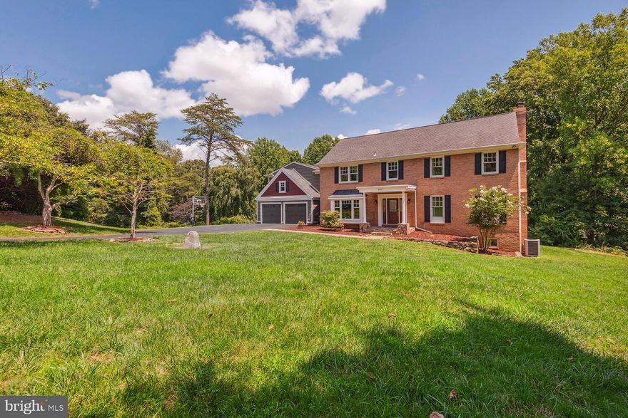Virginian Colonial on 2 acre private lot with large heated pool and pool house with private bath. 6 bedroom, 5 full and 2 half baths, 2 Car Garage, Spacious Floor Plan. Thoughtful upgrades, detailed molding, Andersen wood windows. Hickory wood floors throughout main level/upper level, carpet on lower level. Gourmet kitchen w/ SS, Marble counter tops, Double oven and windowed eat-in kitchen. Tons of natural light throughout home. Two wood-burning fire places. Primary suite has his and her separate bathrooms. Upper level laundry room with option to relocate to main level. Outdoor oasis and private entertaining paradise! Shielded by natural foliage; this custom build has a walk-out to deck w/ custom lighting, herb/Flower beds, and access to yard and pool. Pool house surrounded by flagstone with a covered outdoor living area, private bathroom, and large screen TV/kitchen with sink, grill, warming drawer, and ice maker. All pool equipment controlled by cell phone. Flagstone around pool, coping stones, interior pool surface, and conversion to salt water pool. Owner conveys 120 and 500 gallon propane tanks that heat two BBQ grills, the hot tub, and pool. Finished basement with TV/game room, bathroom and bedroom, spacious storage area. Custom molding, cast iron stair railings, neutral paint & carpet throughout. Interior of home and pool house hard wired with ethernet and coax. Turn key, move-in ready, meticulously maintained, tranquil setting yet only mins to modern conveniences. Easy access to toll road, 66, metro, and downtown Vienna. Oakton ES, Thoreau MS, and Madison HS pyramid.  3D tour attached to listing.