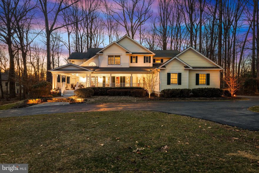 There are some homes that have a certain *feeling*, an atmosphere from the first step over the threshold that inspires visitors with a sense of warmth and welcome. This is one such home! This custom built and designed home exemplifies the "modern farmhouse" style with a stunning wrap-around veranda, multi-gabled roofline and a desirable open-concept floor plan that maintains both formal gathering places and intimate, cozy living spaces. High ceilings and random width solid oak floors carry throughout the main level, allowing effortless transitions from room to room and boasting two handsome fireplaces as focal points in the large expanse of windows that extend across the back of the house.  The solarium addition allows multi-seasonal celebrations (or at-home movie nights) to be spent surrounded by nature with 3 walls of windows; this handsome space has been cleverly designed for easy future main level bedroom suite conversion!  Upstairs, the capacious primary suite has a soaring cathedral ceiling, exquisite built-ins with reading nooks at each window and generously-sized primary bath with dual walk-ins and Jacuzzi tub.  The walk-out lower level offers sizeable, flexible rec space with game and exercise rooms plus full bath and storage space galore. No matter where you are in this delightful home, you'll find the spaces filled with an abundance of light, warmth and charm!