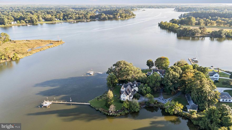 Perfectly sited on the shores of Dixon Creek, this charming home offers timeless elegance and modern amenities across three expansive levels. Sited on 1.437 acres, the property boasts an impressive 618’ of waterfront, offering panoramic views across Dixon Creek and up the Tred Avon River. Inside, the home features gleaming hardwood floors, high ceilings, and four wood burning fireplaces, creating a cozy and welcoming ambiance. The spacious gourmet kitchen offers high-end appliances, coffered ceilings, an excellent center island with 5-burner gas stovetop, breakfast bar, dining area, and sitting area with views to the water. The large family room and paneled library are designed for comfort and relaxation, featuring two of four fireplaces, custom built-ins, and ample room for family living. On the second floor, the grand primary suite presents a generously sized primary bedroom with private balcony, deluxe ensuite bath with glass-enclosed shower and jetted tub, and an ensuite bonus room (could be office; currently a billiard room). Two additional bedrooms, a full hall bath, and laundry facilities complete the second floor. On the third level, discover three additional bedrooms, a full hall bath, walk-in storage room, and an enormous walk-in attic. Outside, the screened waterside porch is ideal for entertaining/dining, and the  cozy fire pit provides the perfect setting for evening gatherings. A private dock with 5'MLW, boat lift and three slips is well-suited for water enthusiasts, while the natural shoreline, framed by mature trees and vibrant landscaping, creates privacy. Additional features include two outbuildings, an outdoor shower, and a 1-car attached garage. This idyllic retreat is perfect for water lovers and those seeking privacy, while being conveniently located between Easton and St Michaels (by car) and Oxford (by water).
Additional information: Septic Approved for 3 BR's and adjacent neighbor has deeded 'Right-of-Way"