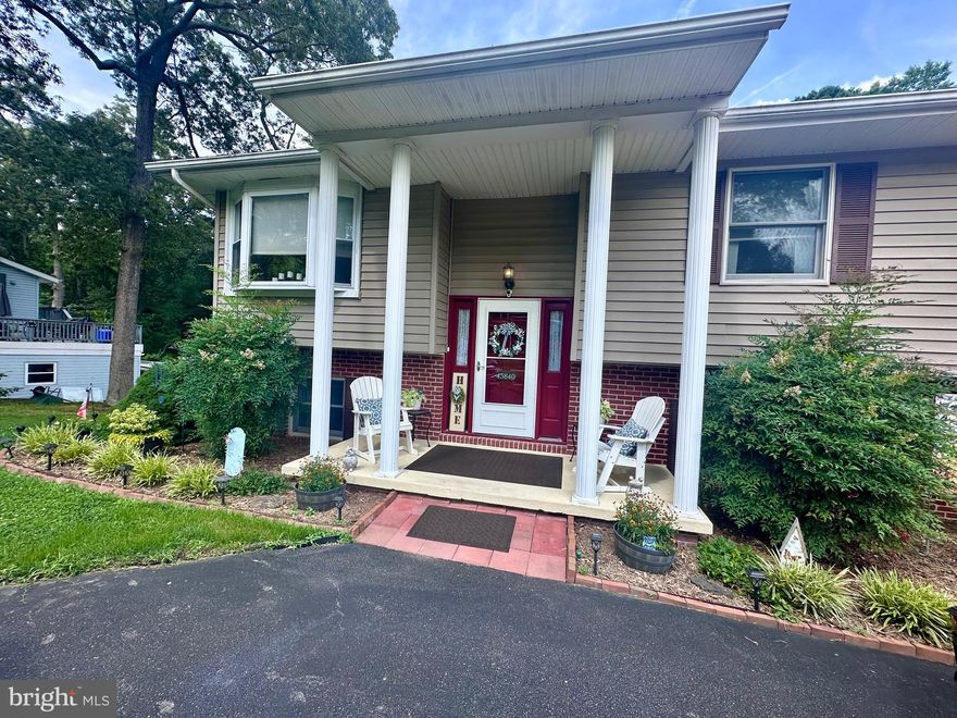 Welcome to 45840 Nancy Lane, a well-appointed 4-bedroom, 2.5-bathroom home situated on a spacious 0.51-acre lot in the serene Friendly Pines community of Great Mills. This thoughtfully designed split foyer residence offers over 2,300 square feet of versatile living space, ideal for both everyday comfort and extended living arrangements.

The upper level features a bright and inviting main living area, complete with a spacious family room and dedicated dining space. The efficient kitchen maximizes functionality with updated appliances and well-organized storage. The highlight of this level is the oversized primary suite, offering ample space and privacy, along with two additional bedrooms and a full bath. A large deck off the main level provides a perfect setting for outdoor dining or quiet relaxation.

The lower level offers a fully finished living space with its own family room, laundry room, fourth bedroom, and a half bathroom. A separate entrance off the deck enhances privacy and functionality.

The home is further complemented with an oversized garage, recently updated appliances and home systems that ensure modern comfort and reliability. Outside, the property boasts a beautifully landscaped yard, two expansive decks, and three storage sheds, providing ample room for recreation, hobbies, and storage.

Located just minutes from local shopping, dining, and the Patuxent River Naval Air Station, with no HOA restrictions, this property offers a unique blend of space, convenience, and quiet suburban charm.