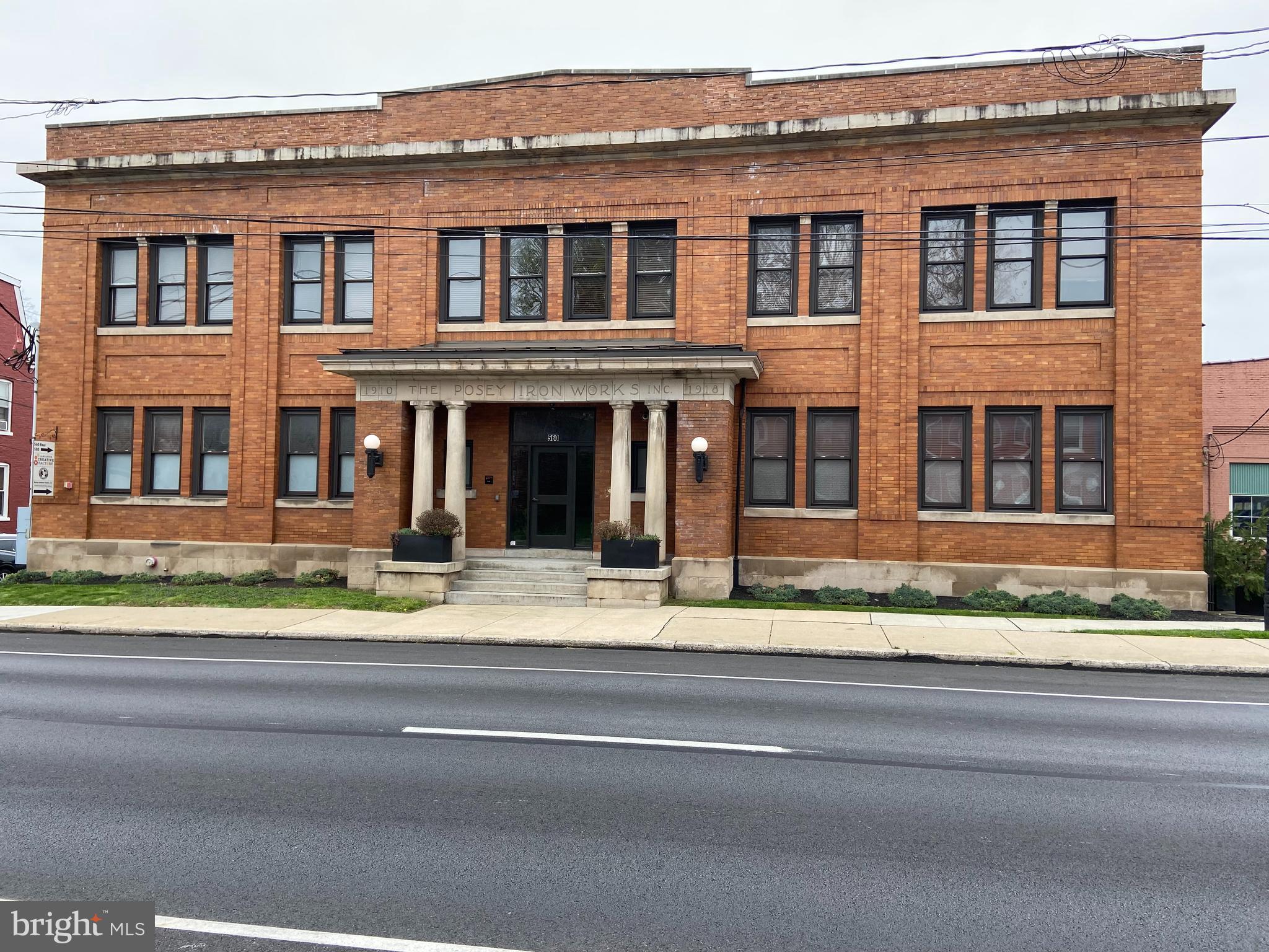 In the summer of 2014 the long, complex process of restoring Lancaster's former Posey Ironworks administrative building was complete. What awaits inside is an urban living experience with all the amenities of home. A card coded entry opens onto a luxurious common area where artful, custom made lighting fixtures span the lobby and harken back to Posey’s original commercial offering: pipe. From the grand oak staircase to original iron installations, you'll see carefully restored historic detail fused with chic interior design to suit your modern life. The building now offers eleven unique one and two bedroom living spaces designed by developer, IronWorks 560 LLC. This project was awarded the 2014 C. Emlen Urban Adaptive Re-use award from the Historic Preservation Trust of Lancaster.