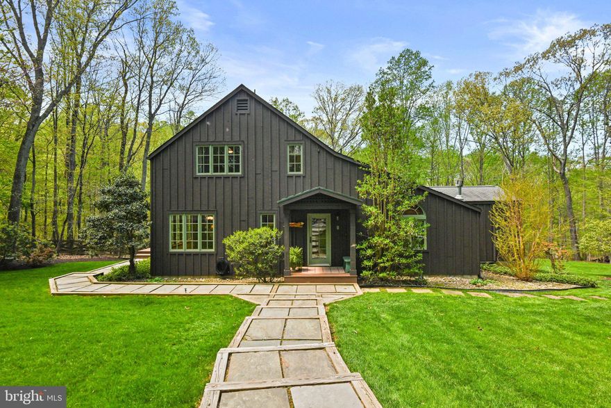 Escape to the rolling hills and natural beauty of Great Falls in this very special and unique 4-bedroom home sited on 5 acres, reminiscent of a ski lodge or Swedish country farm house.  Conceived by a builder from Aspen, you will appreciate the warm pine flooring, trim, and ceilings throughout the residence. All floors include an abundance of windows with sweeping views in every direction of the bucolic landscape. The bathrooms and the kitchen have been thoughtfully updated. The main level bedroom with ensuite bathroom is currently being used as a family room. Enjoy the expansive Trex deck overlooking the lush backyard and endless woodlands. In addition, there is a finished guest suite with a full bathroom above the two-car garage. The circular driveway reveals a fire pit in the center. Located in the highly desirable neighborhood of Potomac Ridge Estates adjacent to the Potomac River and Riverbend Park, this five-acre property provides serenity amidst stunning greenery and mature hardwoods.