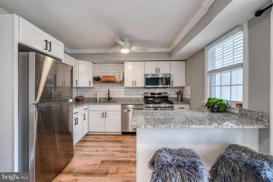 Turn key recently renovated condo in very desirable Homeland Southway community!  Ideal ground level location backing up to private wooded area.  Stainless appliances, recessed lighting, in unit laundry, and brand new flagstone patio!  Gated community with swimming pool, exercise room, easy parking, and electric car charging stations.