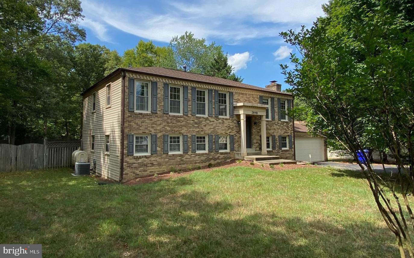This spacious property in the Laurel Branch neighborhood is ready for new owners! Featuring mature trees in the front yard, and a wide, level fenced back yard, this property offers great potential for enjoying outdoor gatherings.
The primary bedroom is very large, with lots of natural light, an extended two-door closet, and an attached bathroom. There is a second small bedroom upstairs which could work very well as a dedicated office space.
The kitchen features stainless steel appliances, recessed lighting, and sturdy cabinetry, with room to install an island or a small kitchen table for comfortable meals. A huge bay window brings abundant natural light into the kitchen.
The adjoining dining room features hardwood floors and french doors leading to the upper level deck, overlooking the back yard.
On the lower level, there is an ideal set up for sharing the space. There are multiple points of entry, including two separate exterior walk-out entrances and a third exit going into the garage. There is also a full bathroom, a large living room with a fireplace and pellet-stove insert, two additional bedrooms, and unfinished storage and laundry rooms.