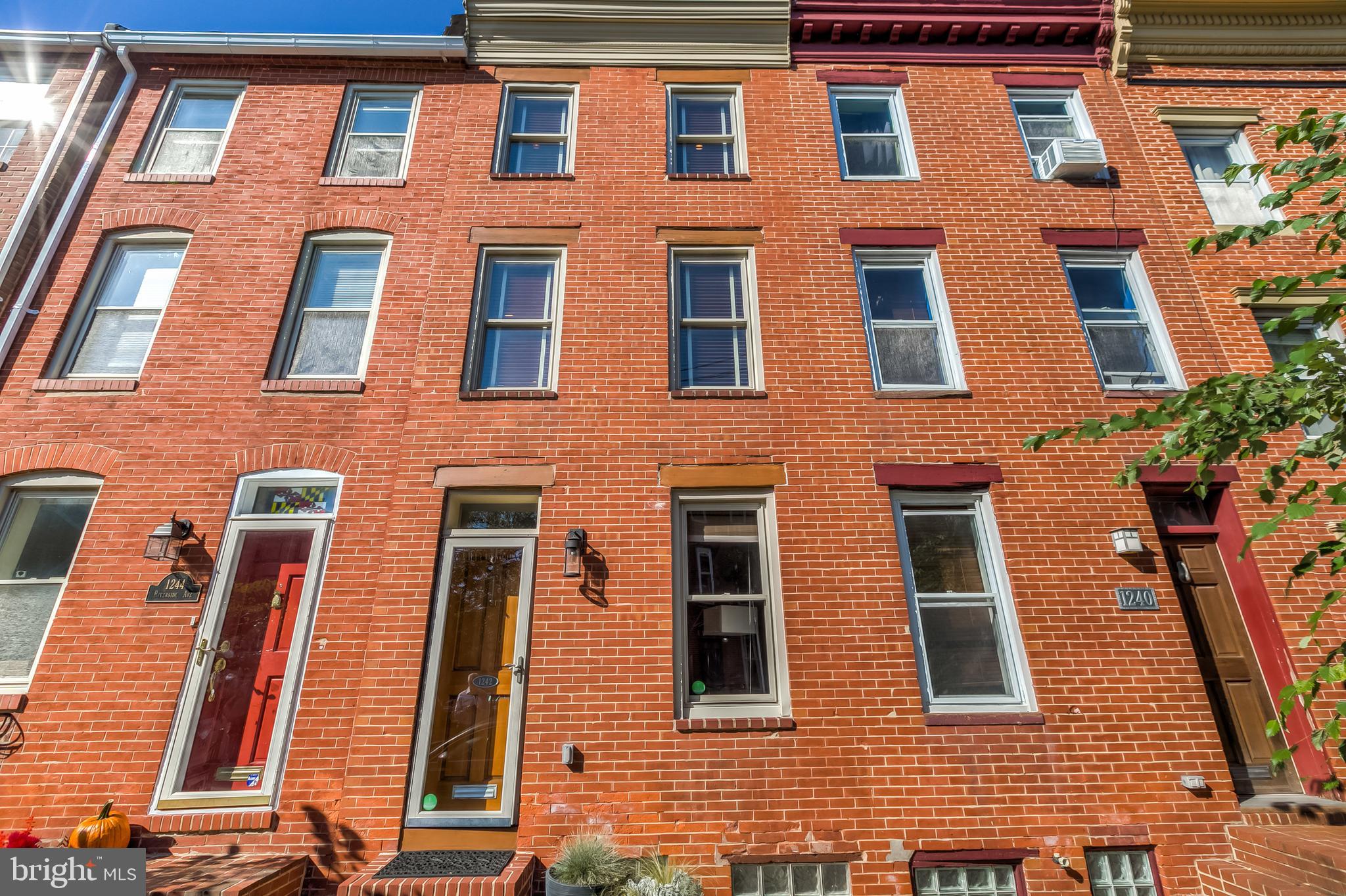 Beautiful Federal Hill home with approximately 2,000 sq. ft. and private parking! This stunning home has a new roof (2020), new appliances (2018/2018), wood floors, exposed brick and recessed lighting throughout! The 1st level has separate living and dining rooms, a spacious kitchen with 42" cabinets, stainless appliances, a high ceiling, tons of natural light and leads to a fenced patio, parking pad & deck. The 2nd floor has 2 bedrooms with great closet space and hallway access to the full bath. The 3rd floor has the primary bed & bathroom, plenty of closet space and hallway access to the 2 rooftop decks. The finished lower level has a family room, half bath & storage.