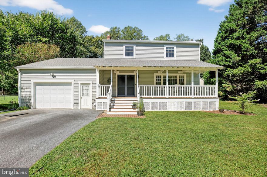 This charming two-story home is located in the Gillens Grove neighborhood and offers 4 bedrooms, 2.5 bathrooms, and a thoughtful blend of classic comfort with modern updates throughout the home.
The main level features a foyer, formal living room, formal dining room, and a fully renovated kitchen. The newly renovated eat-in kitchen opens into a spacious den with built-in shelving and a cozy wood stove, access to the attached garage, while sliding doors provide access to the back deck overlooking the beautiful yard. A convenient half bath completes this level. Newly replaced luxury vinyl plank flooring throughout much of the main floor.

Upstairs, the primary suite boasts a private ensuite bathroom. Three additional nicely sized bedrooms and a hall bath round out the second story. Newly replaced carpet run throughout the upper level.

The home includes a one-car garage currently used as a workshop and laundry area, with attic storage above. Additional highlights include a crawl space with vapor barrier, paved driveway, and a large covered front porch. Recent upgrades add confidence for the next owner—new kitchen, new siding, a new roof, and nearly all new low-maintenance windows installed within the past year. Ductwork has also been re-taped and sealed.

Outdoor features include fenced raised garden beds, two large sheds (one enclosed, one open), and a backyard that backs to woods for added privacy. The original oil heating system was replaced with an efficient heat pump approximately 10 years ago. High-speed internet is available to support work-from-home or streaming needs.

This well-maintained property is move-in ready and waiting for its next owner.