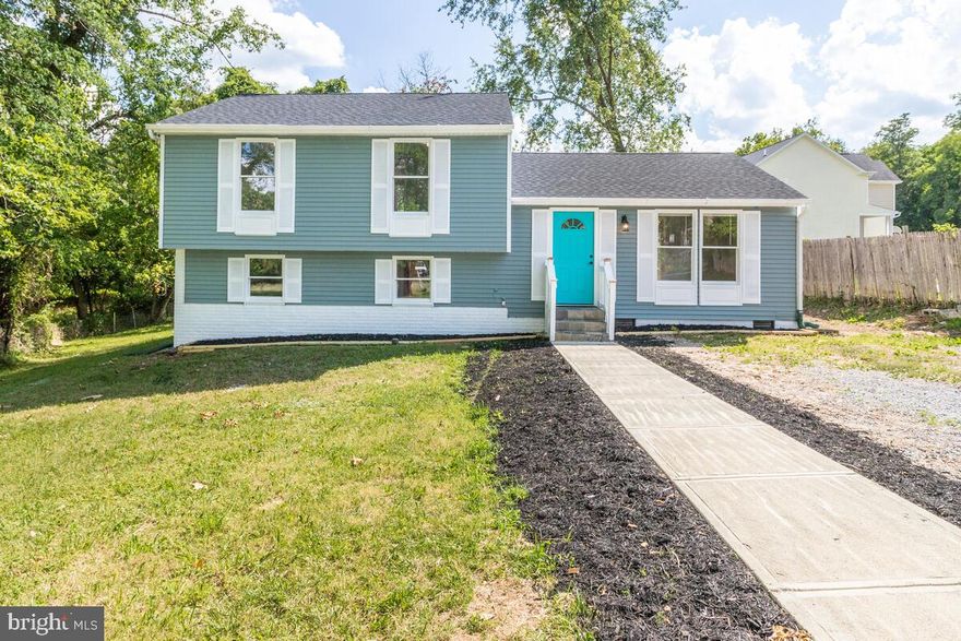This lovely spit foyer SITS ON A HUGE LOT AND IS COMPLETELY RENOVATED.. Enter into an open concept and lots of natural lighting. This home has been stylishly remodeled from head to toe including new floors, fresh paint, new cabinets, stainless steel appliances, recessed lighting and more.   The rooms are very sizeable as well and each bathroom is completely new. The backyard is huge which can be great for any business or gatherings. A new deck is a bonus and front entrance has been freshly paved. All you have to do is move right in! Available to view today!