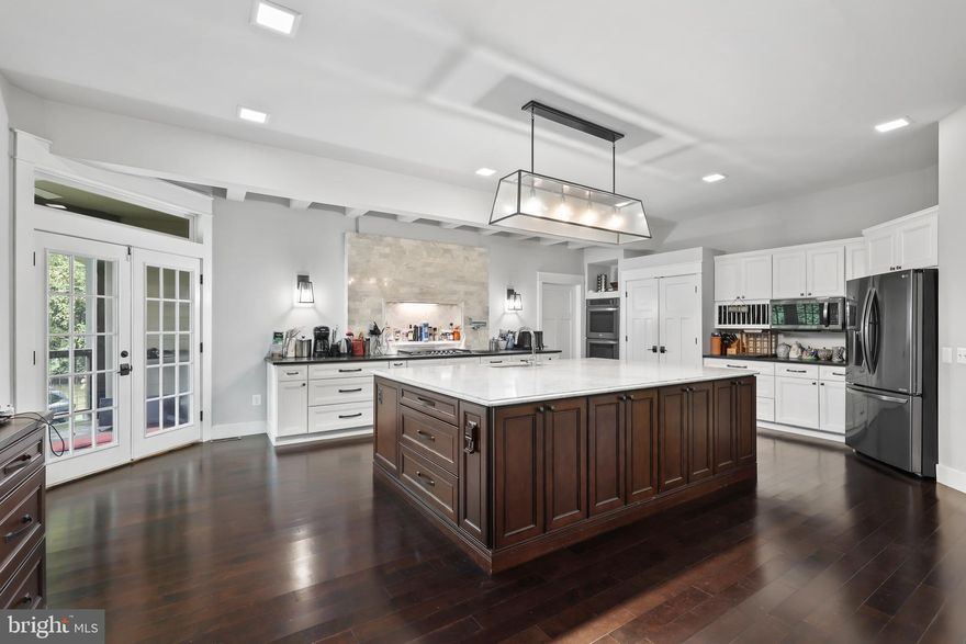 Straight out of a magazine and ready to be Yours! No detail was overlooked in this breathtaking one of a kind contemporary home nestled on a secluded 3+ acre lot. The modern exterior features a slate walk-way leading to a covered front porch ready for countless hours of relaxation while rocking your worries away and watching nature pass by. With almost 5000 square feet on 2 levels, the open concept interior is an environment of refined authenticity and elegance with stylish and durable hardwood floors; craftsman style trim; soaring ceilings; spa inspired bathrooms; plenty of recessed lighting; upgraded light fixtures; and a neutral color palette throughout. The gourmet kitchen is an entertainer’s dream boasting a massive Carrera island; accent ceiling beams; backsplash with recessed cutout; plenty of storage/countertop space; and opens to a sprawling great room and dining area ready for a lavish party or a quiet evening in next to the double-sided fireplace and impressive floor to ceiling concrete accent wall with cutouts. A media room with platform seating and a newly installed mini-split for comfort, spacious flex room perfect for an office, main floor bedroom next to an exquisite full bathroom, and a large mud/utility room complete the main level. Upstairs you’ll find a second large living room, shared bathroom with 2 separate vanities, 3 bedrooms to include a luxurious primary suite with a generous en suite bath, a walk-in closet fit for even the largest of wardrobes and walkouts to a private rooftop terrace ready for morning coffee or relaxing underneath the stars before calling it a night.  Upstairs laundry for added convenience.  Build lasting memories entertaining or just relaxing on the wrap around slate patio overlooking beautiful pastoral views. You won’t be disappointed!