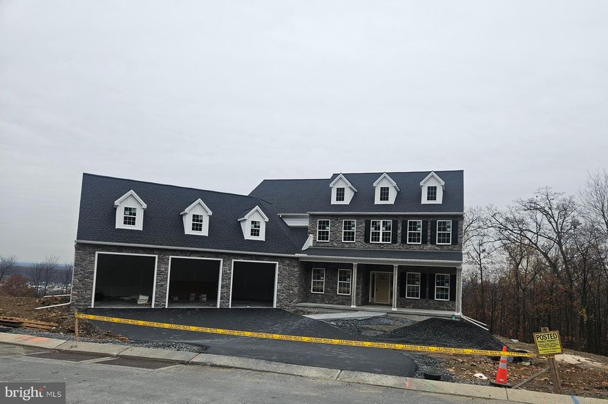 Semi-custom Parliament D model currently under construction in the Estates of Autumn Oaks, offering an expansive and thoughtfully designed open layout ideal for today’s lifestyle. This impressive home features a welcoming front porch and grand 2 story foyer and greatroom with floor to ceiling gas stone fireplace.  Featuring 5 bedrooms and 5.5 bathrooms, along with two in-home offices, providing exceptional flexibility for remote work.  At the heart of the home the gourmet kitchen with oversized island opens to a covered deck, creating a seamless indoor-outdoor living experience and the perfect setting to enjoy the stunning mountain-top views. The walkout lower level offers approximately 1,500 sq. ft. of finished living space, ideal for a recreation room, media area, fitness space, playroom, or additional living quarters complete with a full bath. Beautiful angled oversized 3 car garage with additional storage space above adds to the functionality this energy-efficient, thoughtfully designed semi-custom home has to offer.  Combining quality craftsmanship, modern comfort, and scenic surroundings for a truly exceptional living experience.  Built by McNaughton Homes.