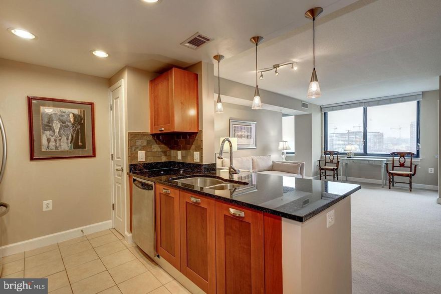 Immaculate 867 sq. ft. 1 Bedroom with Den.  Walk-in closeting, pantry, secondary closets, and a rare extra storage unit .  Washer & Dryer in unit.  Large windows.  Granite countertops with new faucet.  Fresh paint. 
 Garage parking space (#G3-66) is nearest to building entry.  Bicycle parking.  24/7 concierge, swimming pool, hot tub, fitness center, party rooms, and guest suite ($100 night).  Built in 2007 and across from Huntington Metro station.  Tenant responsible for electric and gas.  Verizon Fios and Cox available.   There is a $250 building move-in fee and a $500 building move-in damage deposit.