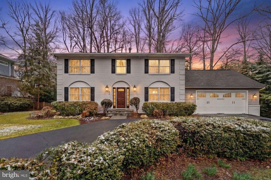 Gorgeous colonial home nestled in the highly sought after Lee Manor neighborhood, offering timeless charm, generous living space, and a prime location. Step inside to a welcoming foyer that flows effortlessly into a bright and expansive living room and formal dining room, creating an open concept feel ideal for both everyday living and entertaining. The main level showcases gleaming hardwood floors, classic chair railing, elegant crown molding, and recessed lighting throughout, adding warmth and sophistication to every space. The gourmet kitchen is truly a chef’s dream, complete with granite countertops, a custom tiled backsplash, a large center island, stainless steel appliances, and a convenient built-in desk area. The kitchen opens seamlessly to the breakfast room, making meal prep and casual dining easy and enjoyable. Just off the kitchen, the family room provides a comfortable gathering space with ample room for seating, relaxing, or hosting movie nights and game days. A conveniently located laundry room and mudroom on the main level add everyday practicality and organization. On the upper level, the spacious owner’s suite offers a peaceful retreat with a walk-in closet and a luxurious en suite bathroom featuring a soaking tub, separate tiled walk-in shower, and dual vanities. Two additional generously sized bedrooms and a full bathroom complete the upper level. The finished lower level expands the home’s living space with a huge recreation room featuring a dry bar. This level also includes a fourth bedroom and a full bathroom, making it ideal for guests, a home office, or an in-law suite. Enjoy outdoor living on the spacious rear deck overlooking a private backyard that backs to trees, providing a serene setting for relaxing evenings, weekend barbecues, and gatherings with family and friends.