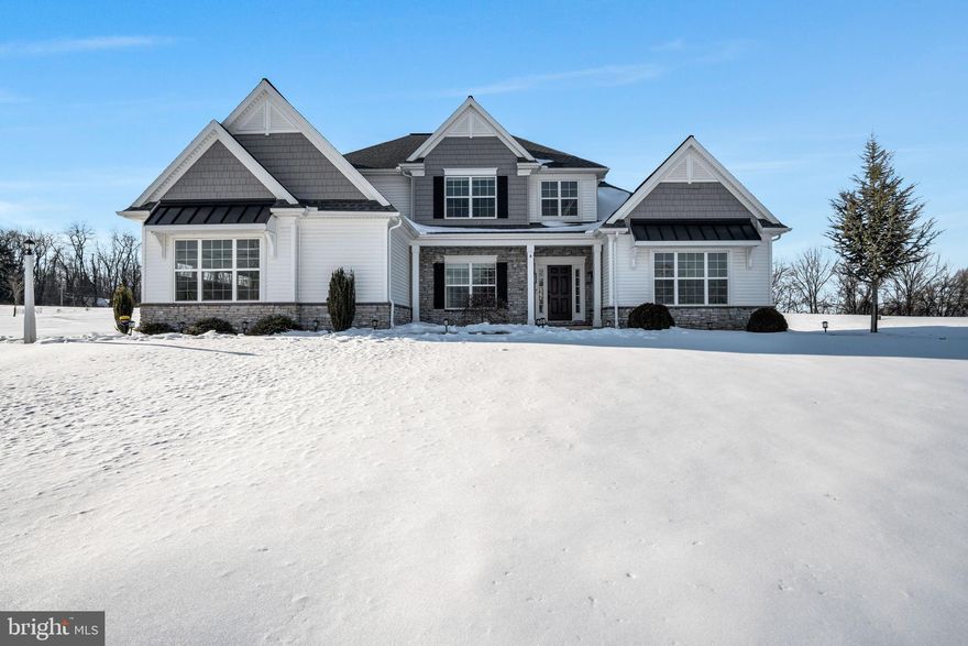 Welcome to 4 Peyton Drive in the highly sought-after Lindenwood community—where luxury, design, and lifestyle collide. This 2020-built home has since undergone a jaw-dropping, magazine-worthy renovation that feels anything but builder-grade. From the moment you step inside, every inch feels professionally curated, highlighted by stunning floor-to-ceiling box trim and a dramatic two-story stone fireplace (complete with a mounted frame TV that conveys). The show-stopping kitchen is a true dream: floor-to-ceiling two-tone soft-close cabinetry with crown molding, farmhouse sink framed by an oversized window, custom hood range, waterfall backsplash, in-countertop outlets, chef’s stove with double oven, French door refrigerator, gold-accented hardware, and a massive oversized island with abundant storage and seating beneath Pottery Barn pendant lighting. A beautifully appointed dining room features a striking light fixture and rich color-drenched walls with trim accents.
Continue to be impressed as you pass the garage entry and discover custom cubbies and bench seating with ceiling-height cabinetry in an on-trend green, paired with a walnut-stained bench and gold hardware. Just beyond, a magazine-worthy laundry room mirrors the same elevated finishes with custom cabinetry, walnut accent paneling, built-in drying rack, and folding space. The first floor offers exceptional convenience with a primary suite featuring a tray ceiling, warm neutral tones, spa-like bath with tiled shower, soaking tub, double vanity, and a walk-in closet with custom shelving. An additional first-floor bedroom includes an attached full bath with hallway access—perfect for guests or multigenerational living.
Upstairs, you’ll find three spacious bedrooms, including one with a private en-suite, plus an additional full bath to serve the remaining bedrooms. And just when you think it can’t get better, prepare to be blown away by the nearly fully finished basement: a dedicated gym room with trendy accent lighting, an in-home sauna that conveys, a massive finished flex space ideal for movie nights or playroom goals, beautiful wood-stained posts, recessed lighting, and neutral carpet throughout. A separate finished room offers the flexibility of a home office or additional bedroom, while the basement kitchenette features two-tone cabinetry, stunning tile backsplash to ceiling, sink, beverage cooler, and elegant countertops. A full basement bath with custom sink basin and full shower adds even more functionality.
Out back, enjoy a rear concrete patio and a playset that conveys, all within a community that boasts its own private walking trail connecting directly to a township trail system. This home is truly one-of-a-kind—designed to impress and built to be lived in. Schedule your private tour today and experience the magic of 4 Peyton Drive for yourself.