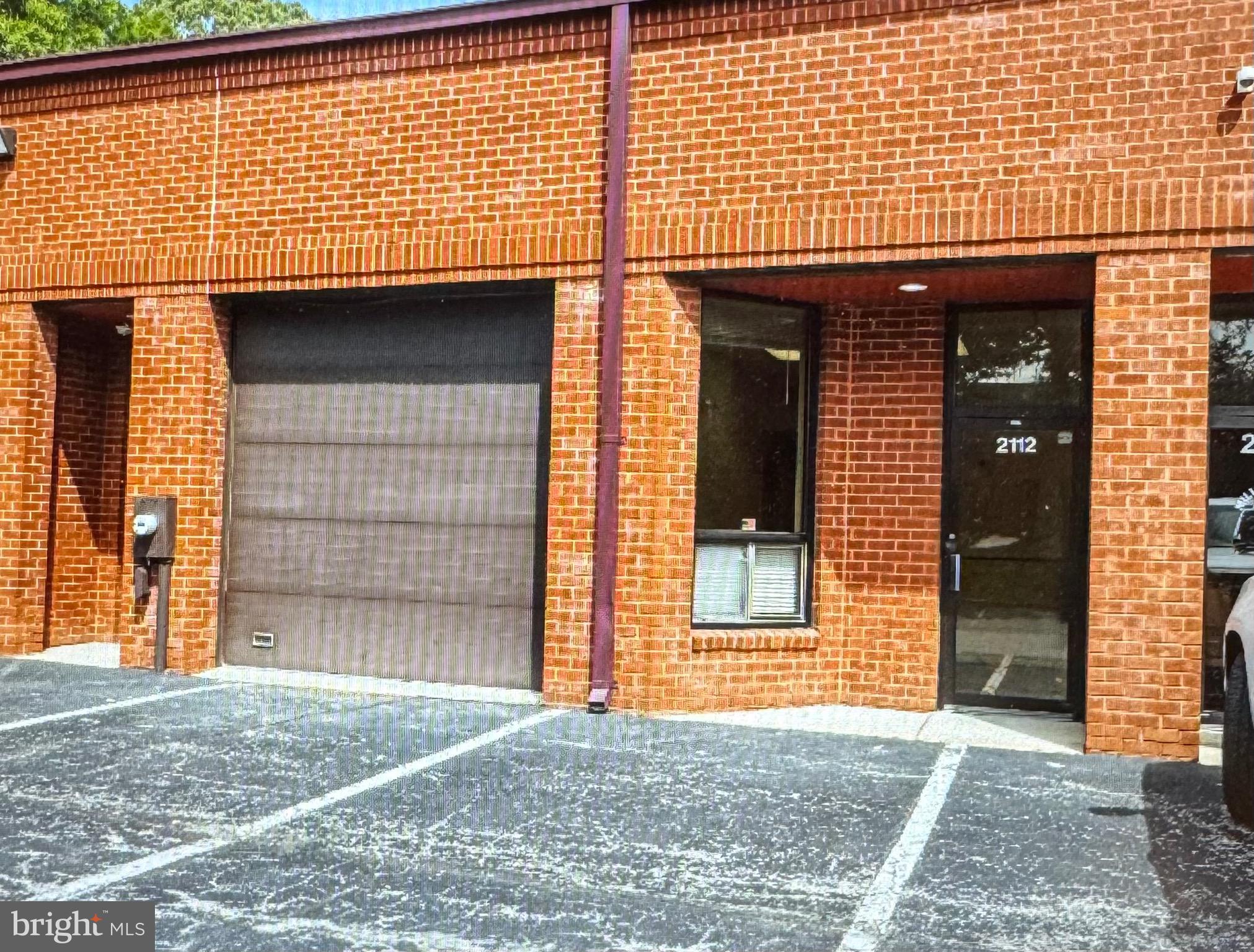 Owner has completely renovated this property. Renovations include bathroom w/a newly installed shower, and a totally new kitchen including granite counters. Entire unit is freshly painted and new flooring installed. The layout includes two private rooms in the back for offices, and an additional room behind the garage door for an additional office, etc. The entrance includes an area that can be used as a reception area.