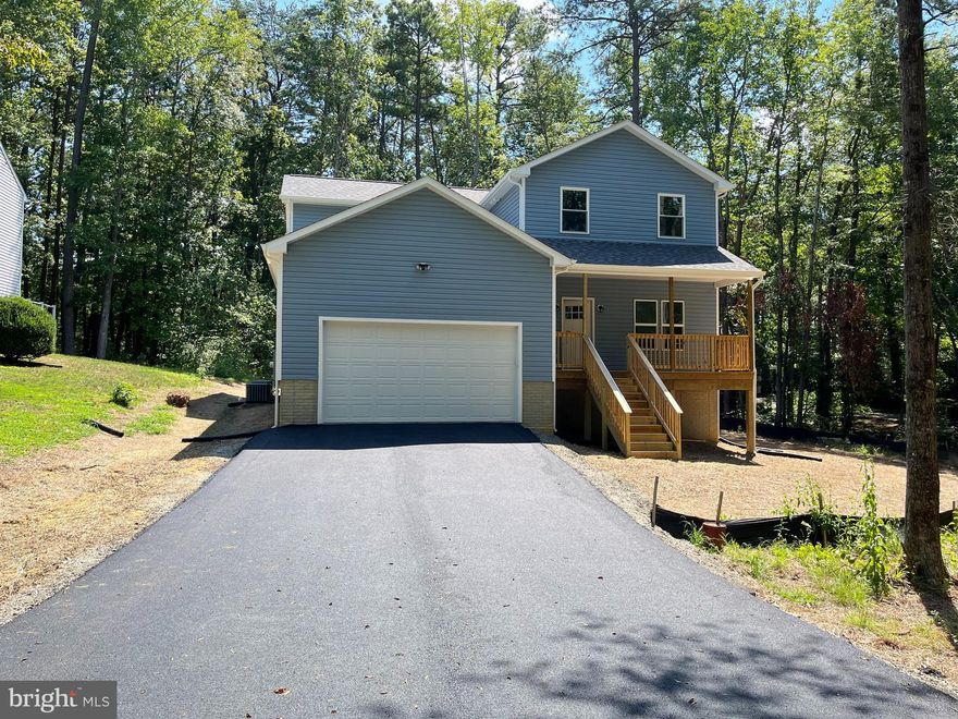 NEW CONSTRUCTION- MOVE IN READY. The lot is partially wooded waterfront Lake Dover in Lake Land Or gated community. This house plan offers 4 large bedrooms 2.5 baths. Primary bedroom offers large closet and ample space. Secondary bedrooms and bath provide plenty of space for large family or remote working at home. The house features stainless steel appliances, beautiful granite countertops throughout, tile flooring in all bathrooms and Luxury Vinyl Plank flooring across the entire main level. Top Quality shaker cabinets, full-overlay with dove tail seams and soft closing on doors and drawers.   The conditioned, unfinished basement offers a great potential for future expansion and use. Become a part of this amazing,  lake centered, gated community of Lake Land'or to enjoy this summer and for years to come!