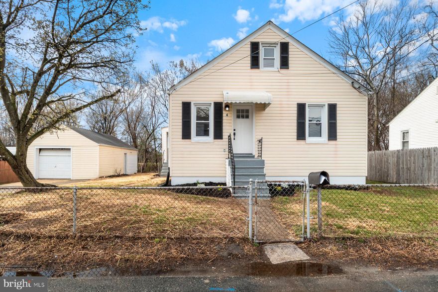 Newly renovated 3BR/2BA expanded cottage, with a detached one-car garage, located on a quiet street in Dundalk. Make your way through the gated yard and step up to the covered entry into your new home. Step inside to a beautifully updated home featuring tons of natural light, a freshly painted interior, crown moldings, wide plank luxury flooring, and beautiful lighting fixtures.  The main living space offers a spacious living room with an arched entry into the dining room,  and another arched entry into the new kitchen. The kitchen features plenty of cabinets, stainless steel appliances, sleek quartz countertops, and a stainless sink under a window. Tucked off the kitchen is an enclosed porch/mudroom.  Walk through into the newly carpeted bedrooms, both with ceiling fans, one with a double closet, and a newly remodeled and beautifully tiled full bath. The lower level features additional living space with a large finished family room, a full bath with walk-in shower, laundry and storage.  Did I mention the bonus loft space? From the mudroom step outside to a spacious yard filled with so many possibilities.  This home is move-in ready and ideal for any new homeowner, and is located in close proximity to shopping, restaurants, and commuter routes.