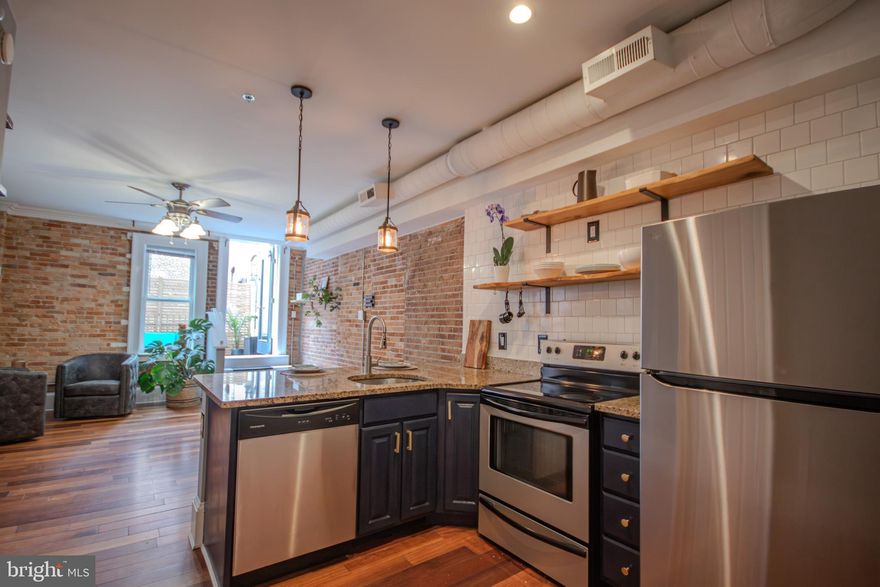 Indulge in the epitome of urban living in this chic and cozy two bedroom , one and half bath condo with a roof top terrace and balcony .Located in the heart of downtown Salisbury,MD, this tastefully designed space combines modern comfort with historic charm! Features include hardwood flooring, original brick walls and sleek granite countertops. A spiral staircase will take you up to the second and third floors within the unique foyer area but  an alternative is an access  to steps to the second floor from the hallway. The modern  walk-in shower is redone and all tiled.  The 3rd floor is flooded with light and if you didn't need it as a second bedroom it would be perfect for an artist studio, yoga and exercise room, plant and garden sanctuary! Whether you're relaxing in the cozy ambiance or entertaining guests in style, this condo offers a seamless blend of history and contemporary living. So close to all Salisbury has to offer located on the Plaza! Walking distance to the University-1 mile, the hospital-across the st-restaurants-two downtown-Unity Square with it's water splash pad , sculptures,and  music festivals-right behind the building! Bike -walk  or drive-you will have found your happy place.