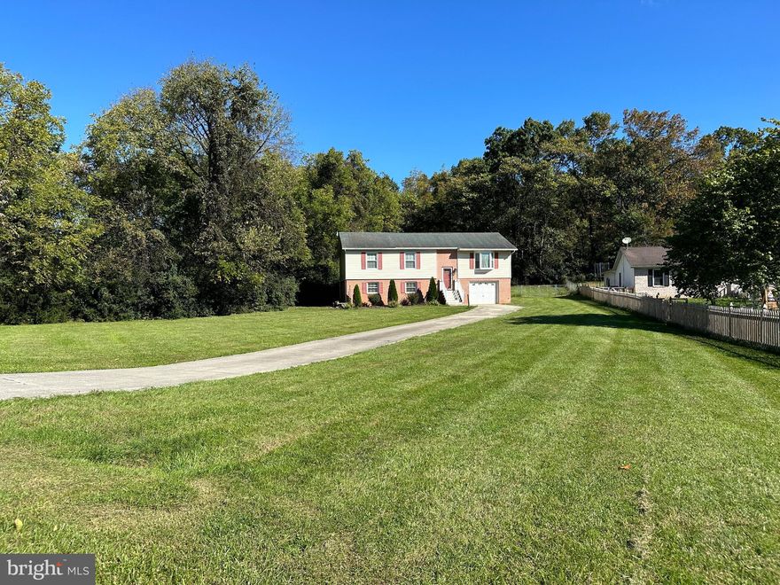 Now available for rent in the Sylvan Grove community! Spacious 4 bedroom 3 full bath split foyer home with 1 car garage, rear deck, and fenced rear yard with storage shed.  Heat pump with central air as well as a pellet stove for tenants use and the Landlord has even left bags of pellets for tenants to use.  Primary bedroom on main floor with walk in closet and full bath as well as another large bedroom with walk in closet and bath in the basement off the family room.  Animals considered on case by case basis.  Apply online thru listers website or by VAR or NVAR rental application with $50 per person over 18 yrs old application fee.