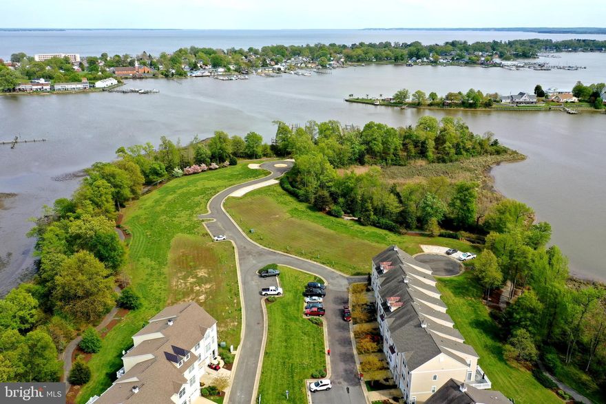 WATER VIEW Garage Townhome with Boat Slip and Lift on Monroe Bay!   Must see to appreciate the light and airy  feel this private end unit offers.   Features hardwood flooring throughout, ceramic tile, granite counters, upgraded appliances, security system, wireless thermostat, myQ Smart Home Lift Master Garage  and more.  Primary bedroom en suite with water view has two walk-in closets.  Entry level foyer leads to a large family room plus full bath for an extra guest room.  Very reasonable HOA fee and low maintenance living at its best.  Truly an excellent buy in Colonial Beach with golf cart access to beaches, marinas, shopping, restaurants and events.