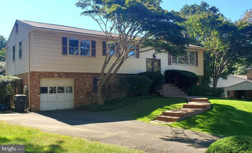 Move-In Ready,  Almost double the  listed square footage, on this home.... First Time Offered as a Rental in Sought after Falls Church Location in McLean High School Pyramid!  One Car Garage with driveway, Detached Solid Brick 4BR/3BA Home on a Cul de sac, (no through street).  Pride of ownership shows throughout with the fresh neutrally painted interior walls and gleaming original hardwood floors!  Upper Level boasting 3 Spacious  Bedrooms, 2 Full Baths, Formal Livingroom  with a woodburning Fireplace that shares the  ambiance  with the Dining Room.  Brand New Stainless Steel Appliances to include Stove, Microwave, and Double Door Fridge w/icemaker in the white wood cabinet Kitchen with convenient separate Eating Area and direct access to the outside deck w/stairs to the spacious back yard.  Lower Level Yard with two Entrances to the  436 sq foot Recreation Room featuring a  decorative wall of bricks 2nd Fireplace, New Engineered wood floors & secure built in shelving with wine rack, 3rd  Full  Ceramic Bathroom,  and 4th  Spacious Bedroom, Laundry Room  w/wash sink, New Washer, & Dryer.  Lower Level Hall leads to additional space with shelving, storage area and a workbench ,  2nd Refridgerator, garage with more shelves, & automatic retmotely operated door .   Only a couple stop lights to Metro, Geo. Wash. Memorial Parkway, Rt66, 495,  DC, Tysons & Mosaic Shopping Areas,  and  Airports.