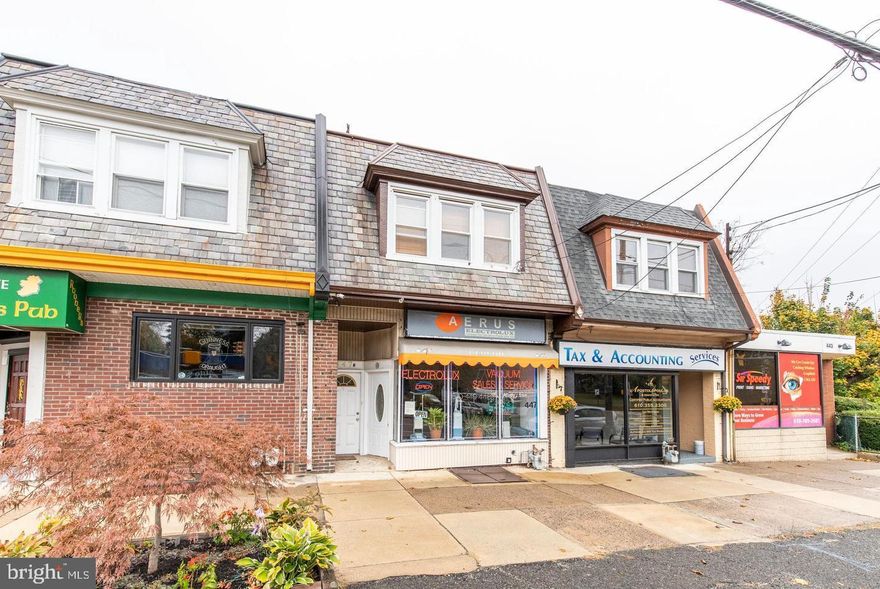 First floor is retail space with off street parking (4 cars), second floor is 2 bedroom apartment