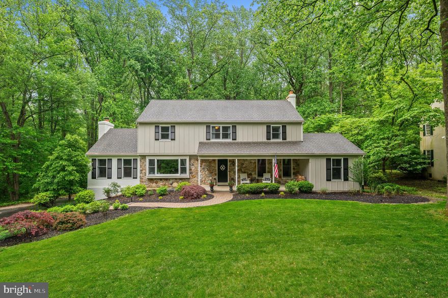 Welcome to 1047 Beaumont Road, a stunning home nestled in one of Berwyn’s most sought-after neighborhoods. With 4 spacious bedrooms, 2 full baths, 2 half baths, and over 3,000 square feet of beautifully maintained living space, this property offers the perfect blend of classic charm and modern updates. Step through the beautifully landscaped front yard to the inviting covered porch. Inside, the first floor welcomes you with a large formal living room featuring a cozy fireplace and original hardwood floors — currently used as a dining room, but easily adaptable to your needs. Adjacent, you’ll find a versatile bonus room, perfect for a home office or den. The renovated eat-in kitchen shines with crisp white cabinetry, stainless steel appliances, marble countertops, and abundant storage and prep space. Just off the kitchen, the formal dining room (currently set up as a sitting room) offers gorgeous natural light and views of the front yard. Flowing effortlessly from the dining and kitchen areas is the spacious family room, complete with a wood-burning fireplace and custom built-ins, creating an ideal hub for everyday living and entertaining. A convenient laundry room and powder room round out the main level. Step outside to the large screened-in porch, perfect for summer meals or quiet mornings with coffee, and enjoy the private backyard that backs onto nearly 30 acres of preserved land — an incredible setting for barbecues, garden parties, or simply relaxing in nature. Upstairs, the expansive primary suite offers a walk-in closet and a beautifully updated en-suite bathroom with a dual vanity and tiled shower. Three additional generously sized bedrooms and a full hall bath complete the upper level. The finished basement provides extra living space, ideal for a playroom or rec area, along with ample unfinished storage and practical cubbies for easy organization when entering from the attached two-car garage plus an additional half bath.This gorgeous home truly has it all — space, style, and a coveted location. Don’t miss your opportunity to make 1047 Beaumont Road your forever home!