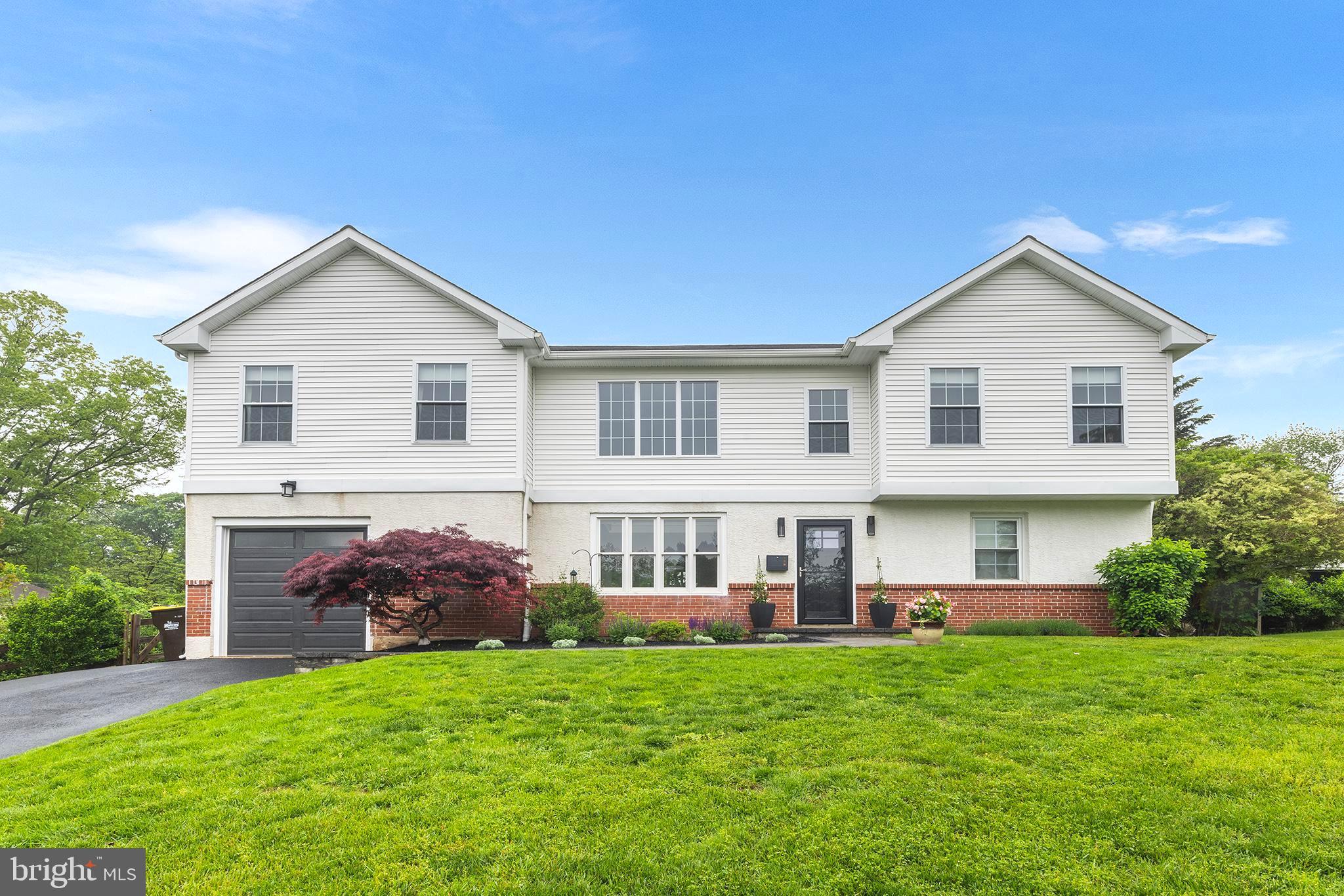 Welcome to this sunlit, open-concept residence in the award-winning Tredyffrin-Easttown School District, where thoughtful design meets everyday functionality. Step inside through a dramatic two-story foyer and feel the sense of space and light that defines this exceptional home.
To the left, a gracious living area anchors the main level with a gas fireplace framed by a reclaimed barn wood mantel and two stories of oversized windows that flood the space with natural light. On the opposite side, a versatile gathering area invites quiet conversation, morning coffee, or evening cocktails.
Overlooking the backyard, the chef’s kitchen is as functional as it is beautiful. Custom cabinetry, quartz countertops, stainless steel appliances, and an oversized peninsula create an ideal setting for cooking, dining, and entertaining. Adjacent to the kitchen, a spacious dining area opens directly to a private outdoor retreat. A flexible bonus room, perfect for a home office or playroom, completes the main level along with a powder room, coat closet, and access to the attached one-car garage. Luxury vinyl plank flooring extends throughout the first floor, offering both elegance and durability.
Upstairs, a striking open hallway overlooking the first level leads to four generously sized bedrooms, including an expansive primary suite with dual walk-in closets. A well-appointed hall bath completes the second floor, set against a backdrop of fresh, neutral paint throughout.
The fully finished lower level provides abundant space for media, recreation, and remote work, along with a full bathroom and dedicated laundry area.
Outside, the backyard offers a private oasis designed for effortless living. A composite patio is perfect for entertaining, while built-in flower beds, a fire pit area, and mature landscaping create a serene backdrop. A storage shed offers convenient additional space.
Ideally situated just minutes from both the Daylesford and Paoli train stations with service to Center City and Amtrak access to New York. Enjoy close proximity to King of Prussia Town Center, Terrain, top-rated dining and boutiques, and major routes including 202, the Blue Route, Schuylkill Expressway, and the PA Turnpike. 55 Dayleview is an exceptional property offering comfort, style, and connection to everything that makes Berwyn such a special place to call home. *OFFER DEADLINE* Sunday, 6/1 5PM.