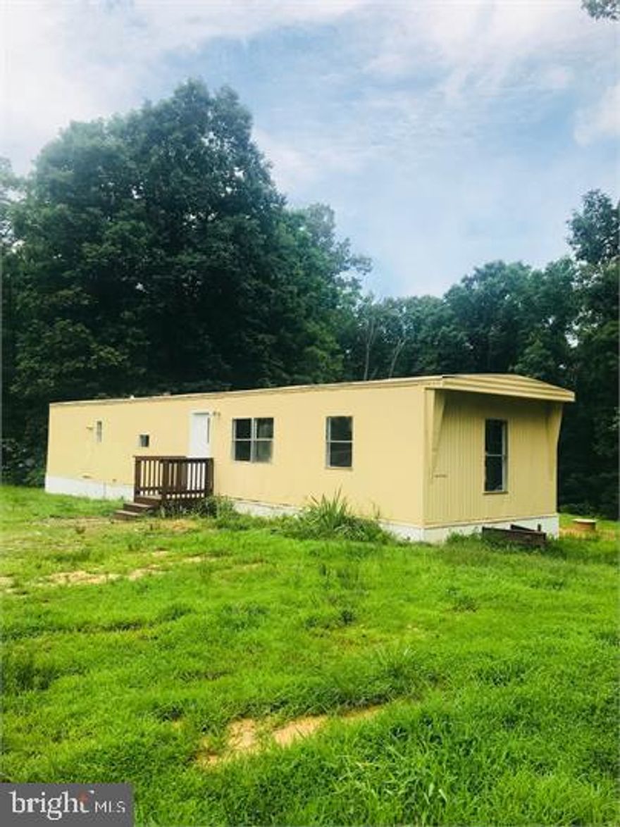 2 Bedroom, 2 Bathroom manufactured home with spacious yard and lots of privacy on 2.2 acres! Home features a living room and eat-in kitchen. (Washer hookups only).